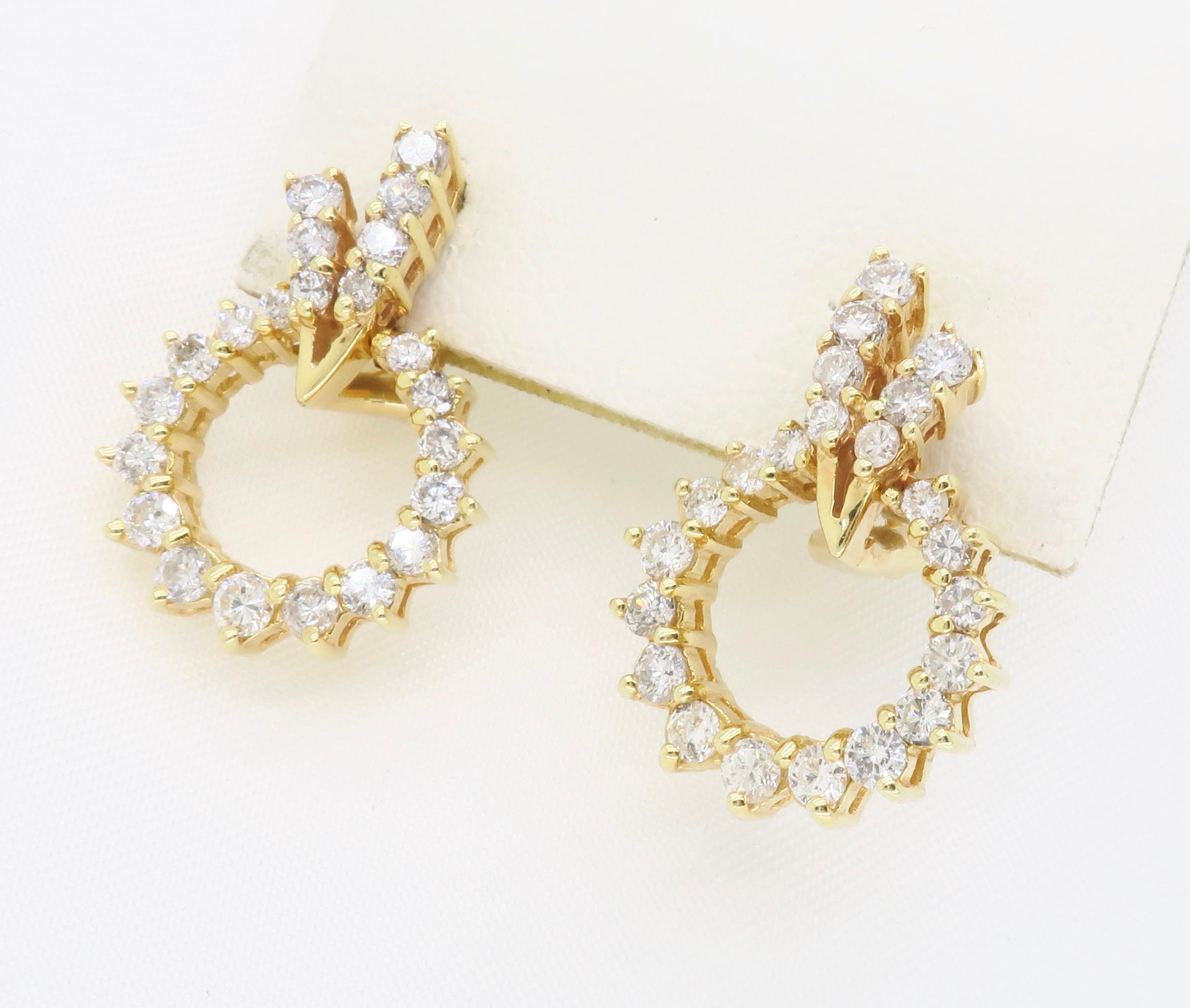 Unique 14k yellow gold omega back earrings set with 1.20ctw of Round diamonds.

Diamond Carat Weight: Approximately 1.20CTW 
Diamond Cut:  Round Brilliant cut
Color: Average G-I
Clarity: Average SI
Metal: 14K Yelllow Gold 
Marked/Tested: Stamped