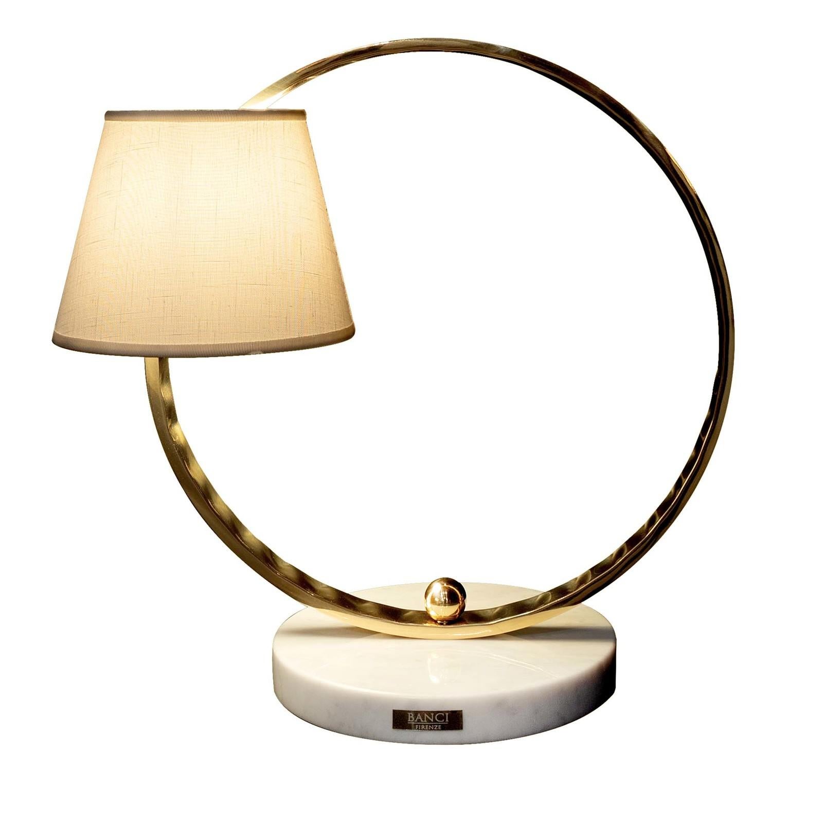 Open circle single light table lamp.