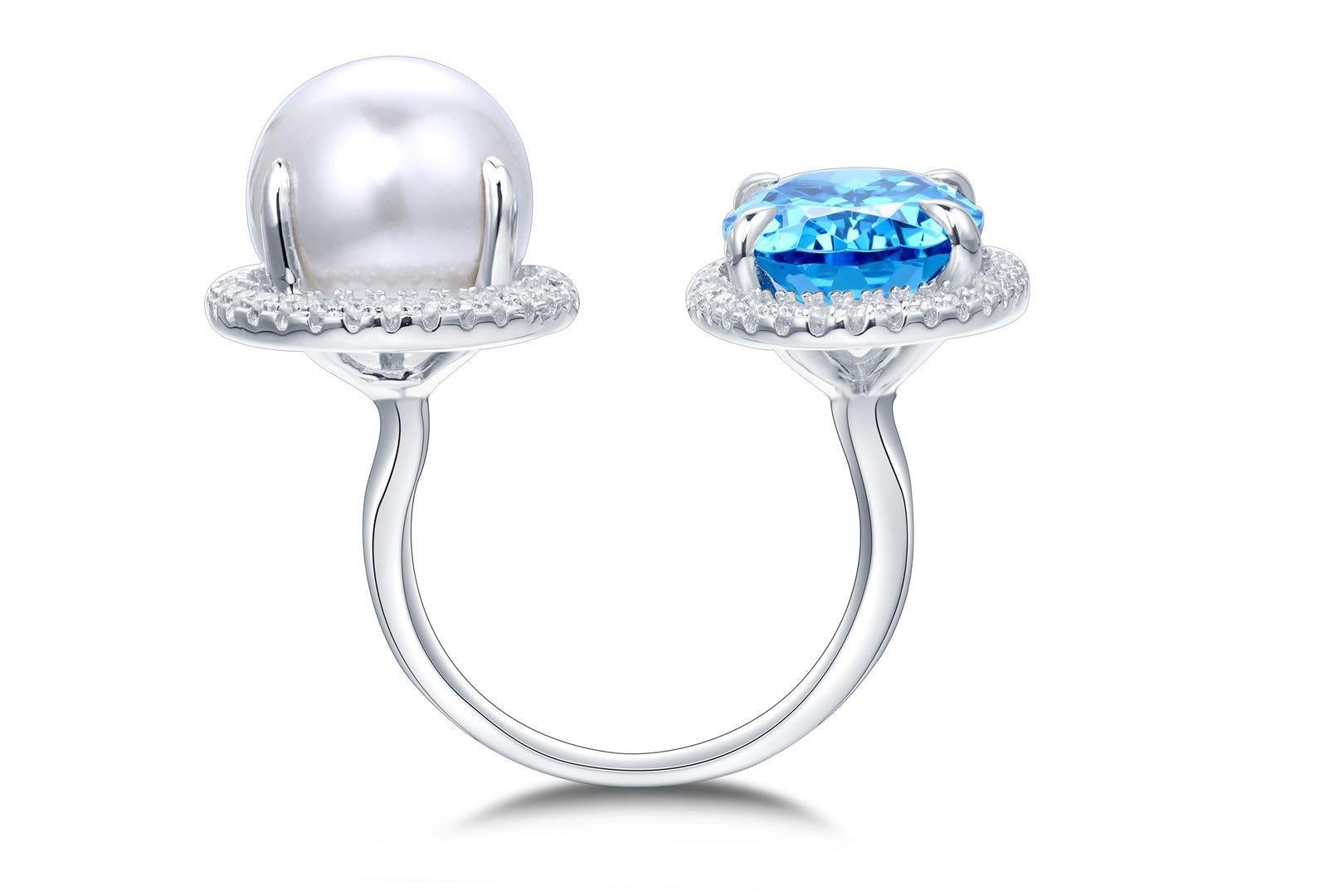 Beautiful double ring with simulated blue topaz in colour London blue, cubic zirconium and faux pearl. Ring is made out of 925 silver and rhodium pleated, so won't tarnish.
Going to look stunning with casual and evening outfit. 

Sizes available -