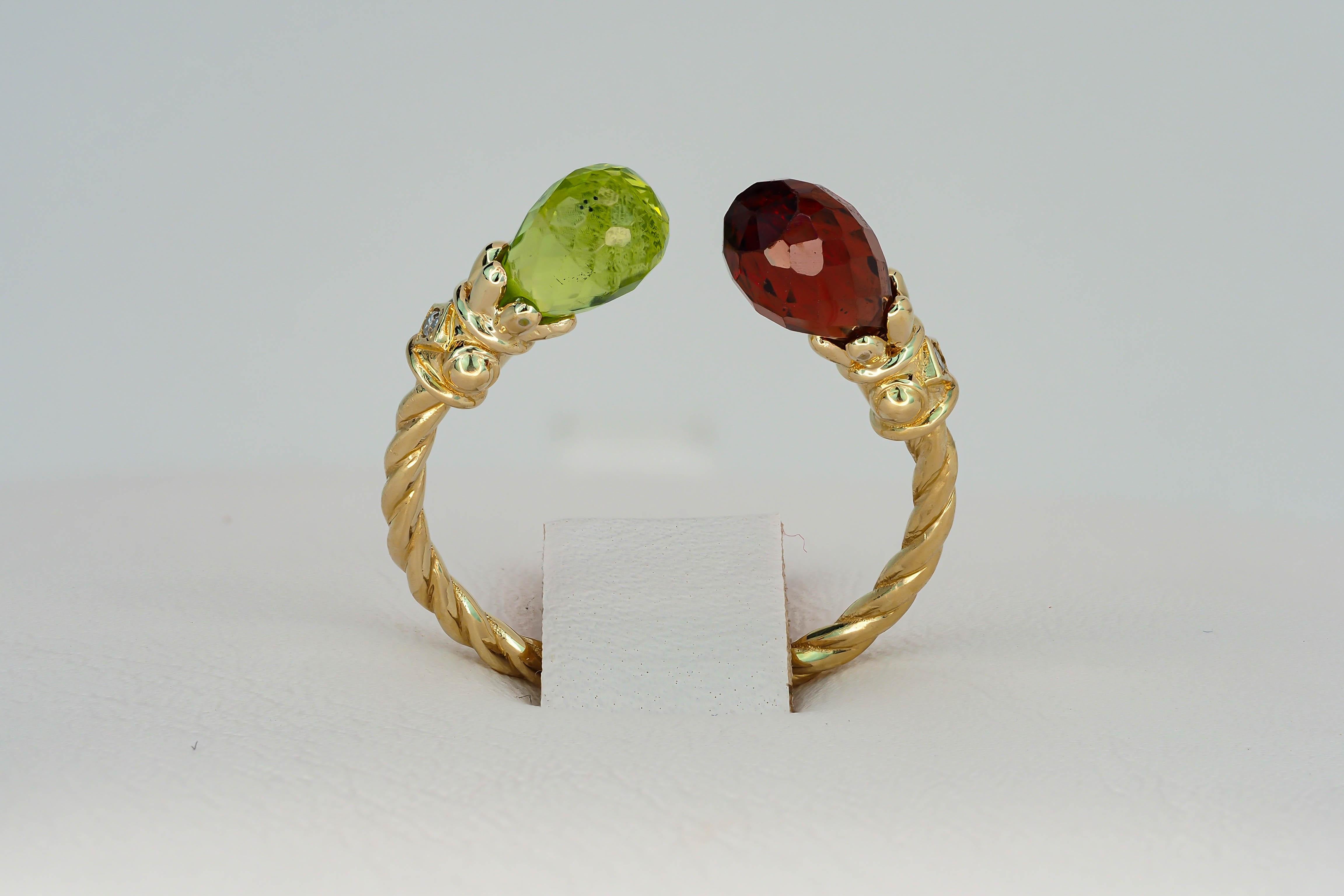For Sale:   Open ended gold ring with peridot, garnet and diamonds 18