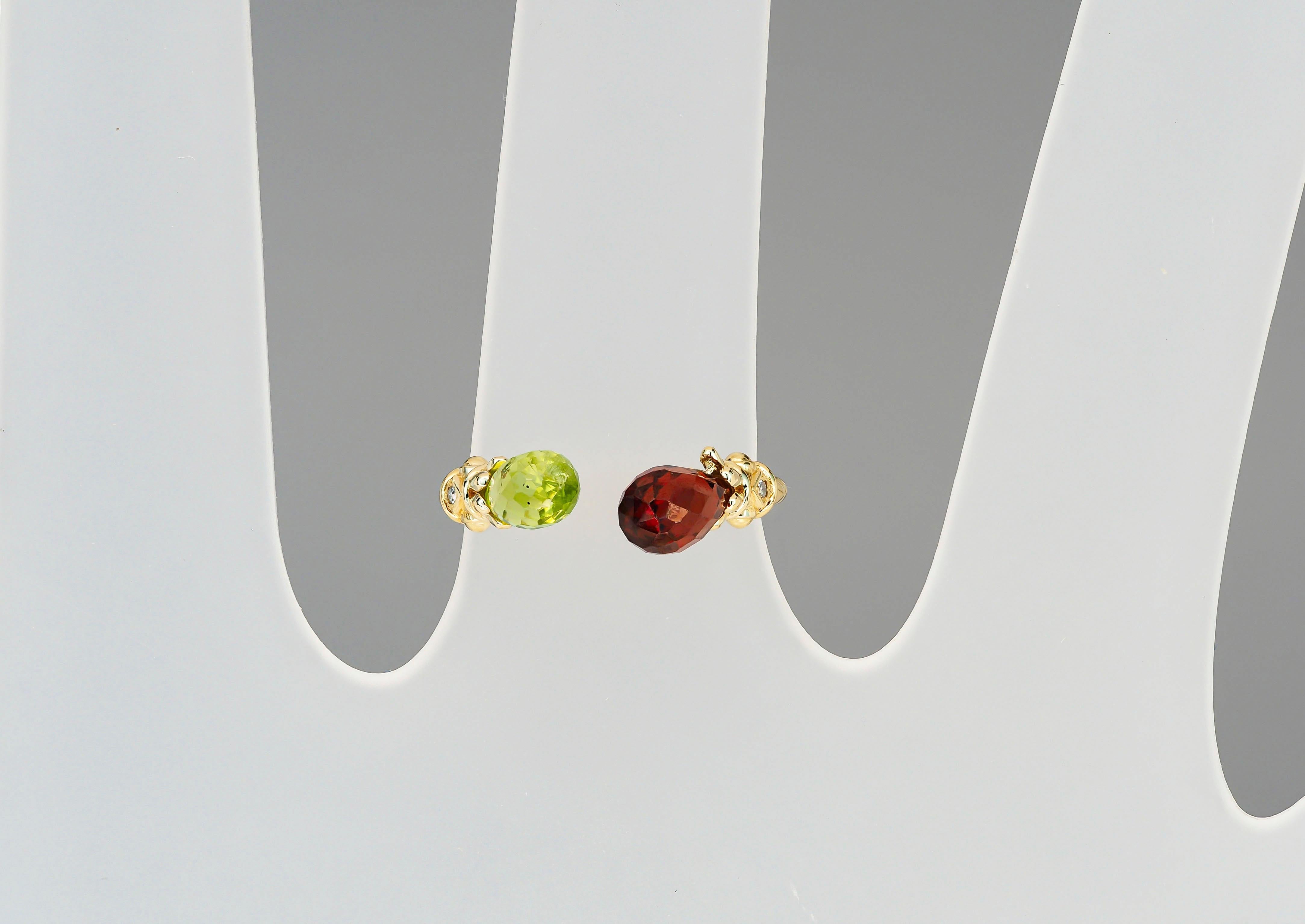 For Sale:   Open ended gold ring with peridot, garnet and diamonds 20