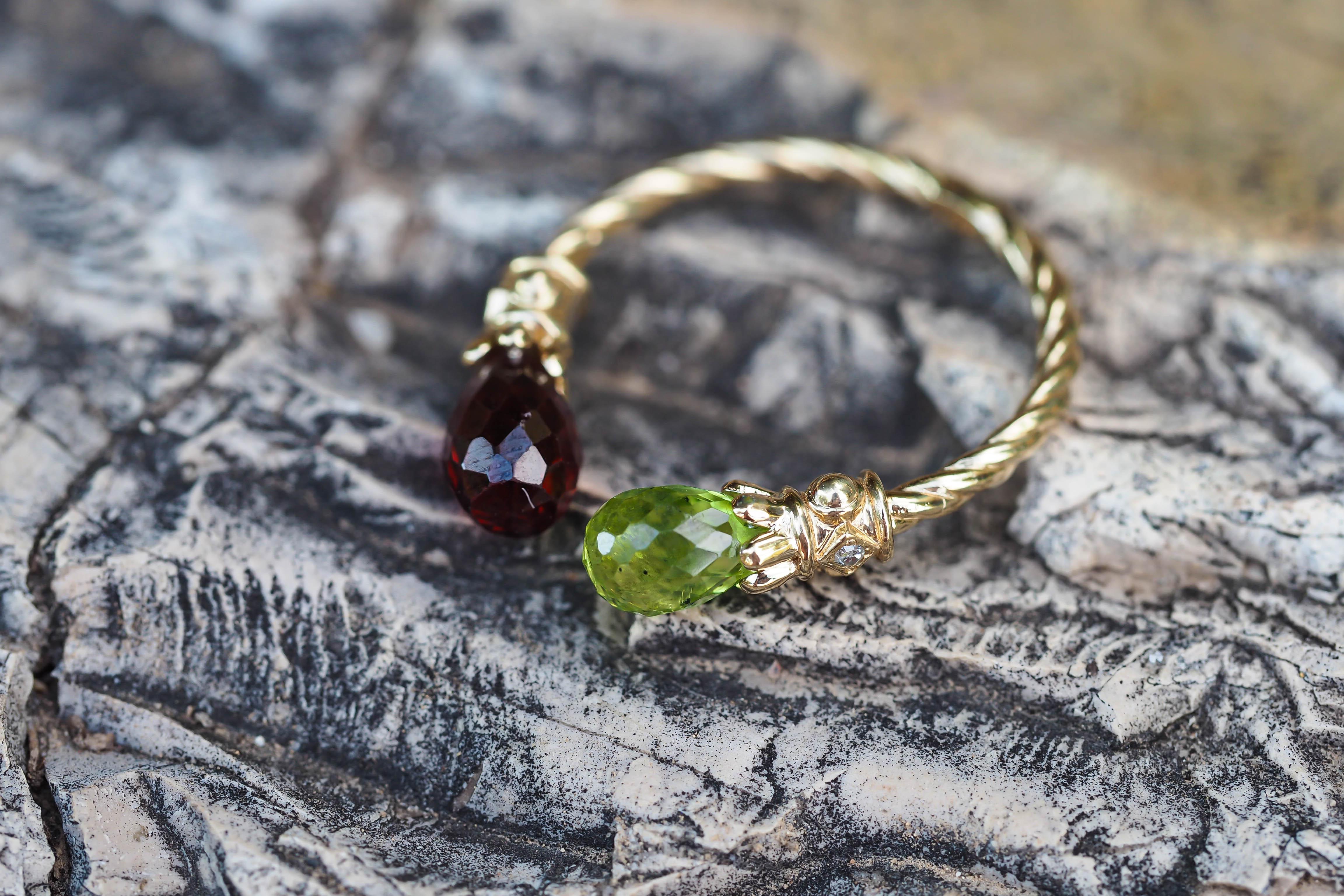 For Sale:   Open ended gold ring with peridot, garnet and diamonds 8