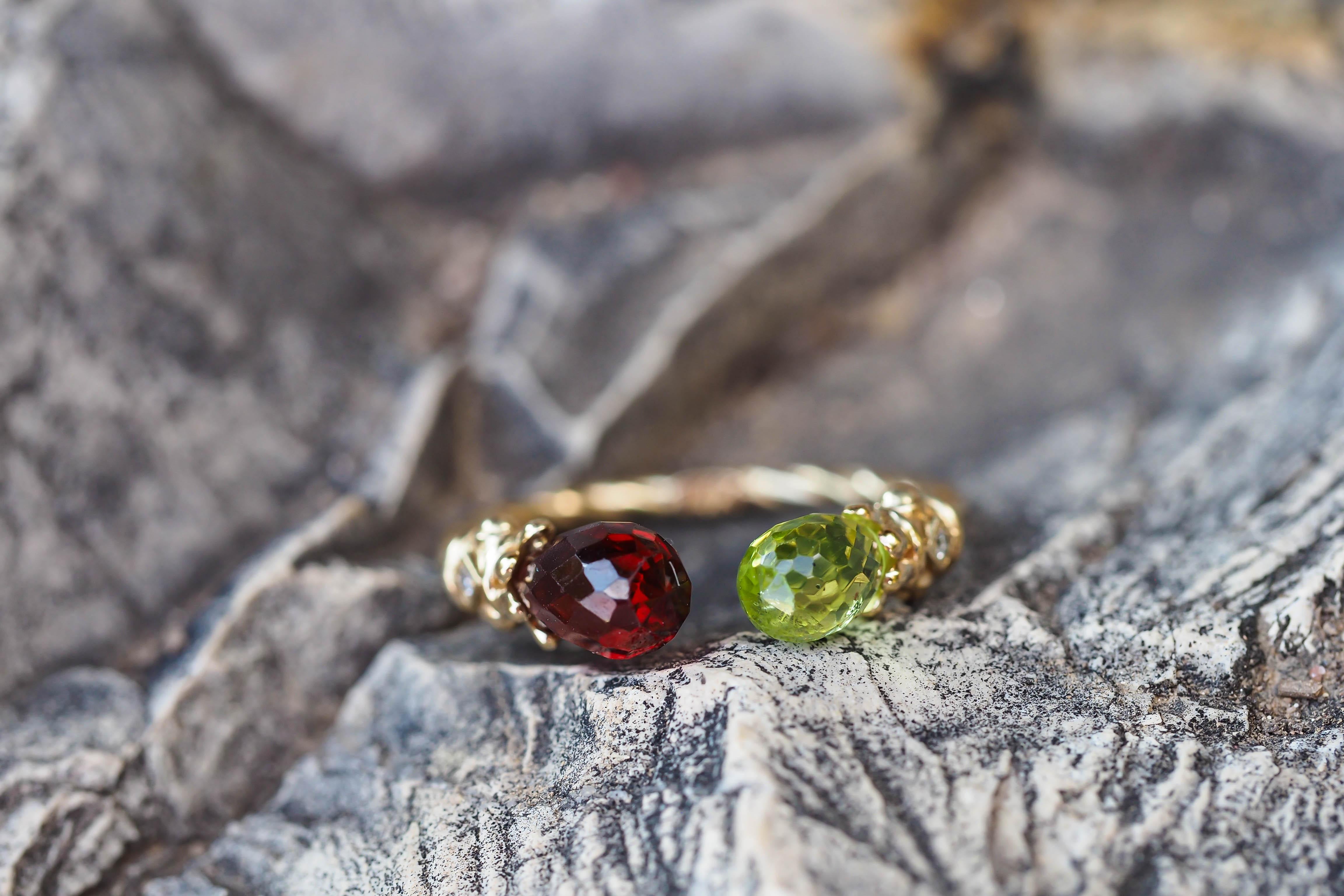 For Sale:   Open ended gold ring with peridot, garnet and diamonds 9