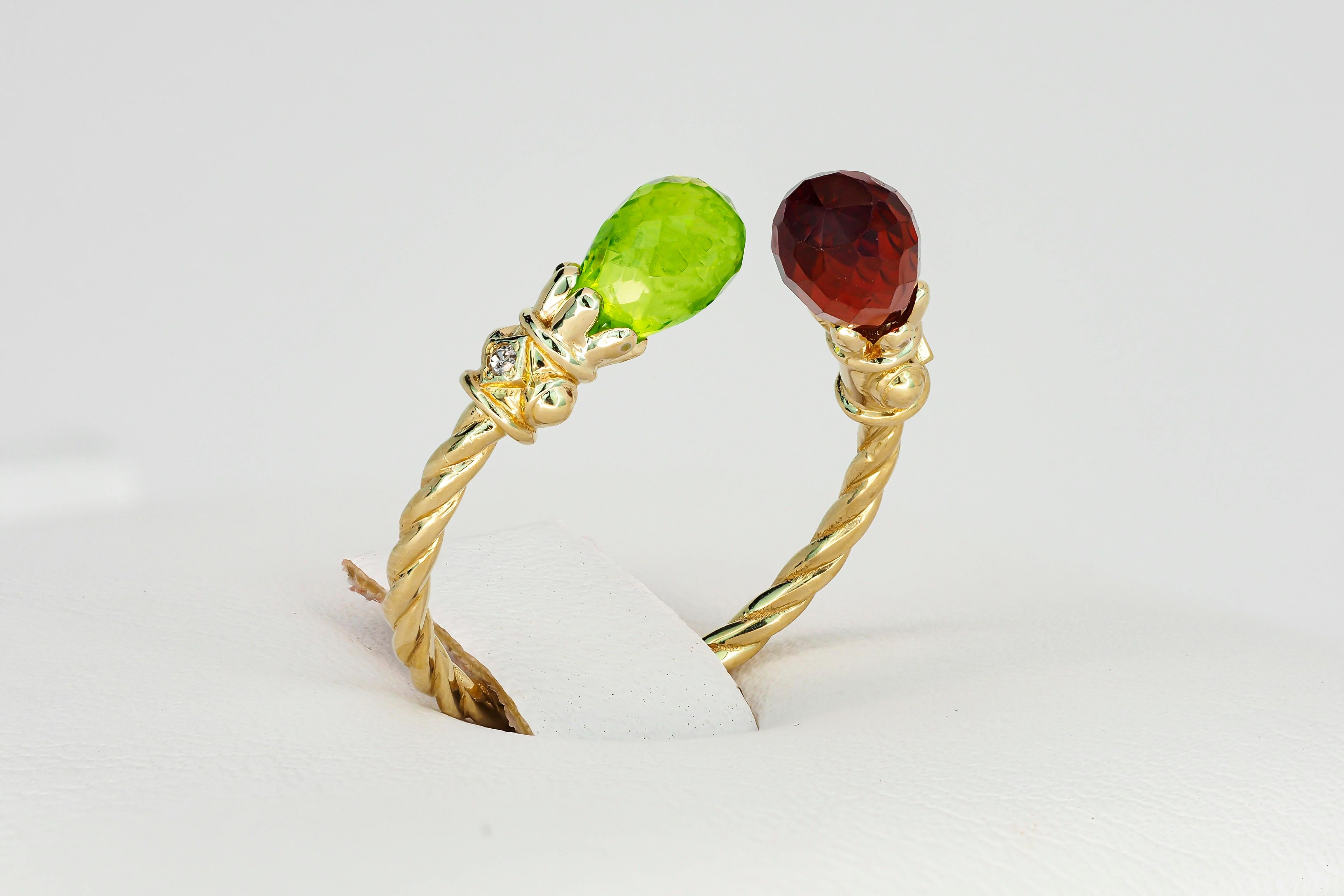 Open ended peridot, garnet 14k gold ring. 
Briolette gem gold ring. Garnet gold ring. Peridot gold ring. Adjustable gold ring.

Metal: 14k gold
Total weight: 2.60 g. depends from choosen size.

Stones: 

Peridot:
Cut: Briolette
Weight: approx 1.0