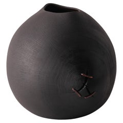 Open form vessel in blackened oak with copper detail