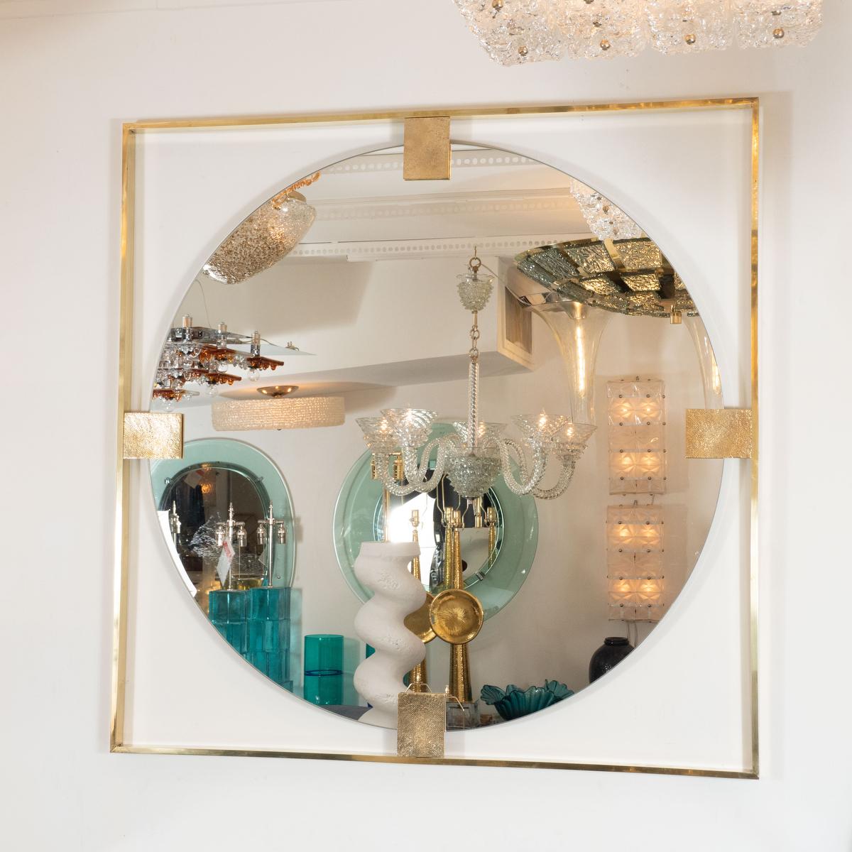 Square, open-frame brass mirror with brass clip details.