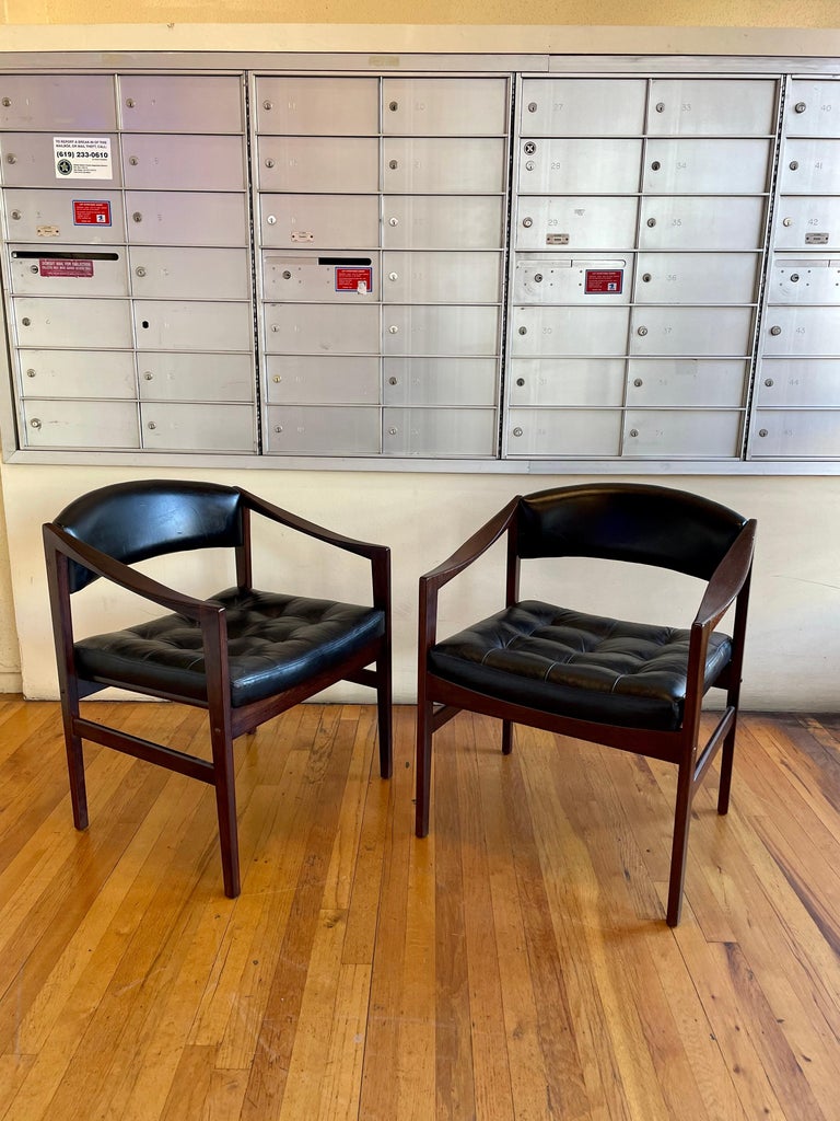 Open frame lounge chairs, Dux, for Dunbar. Rosewood frames are freshly finished and have black leather upholstery, nice condition solid and sturdy.