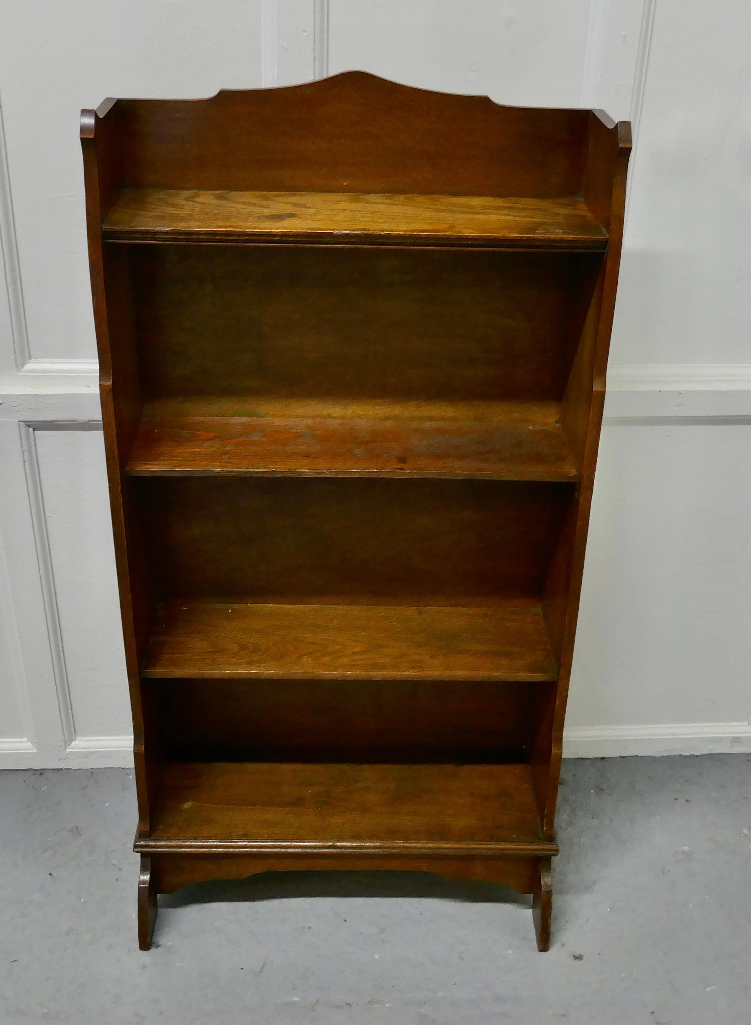 Open front oak bookcase.

This oak bookcase has 4 shelves, the top has a neat gallery and it stands on a neat plinth, the Bookcase was made by G. Hardy & Co, Manchester
The bookcase is in good attractive condition and would work very well in your
