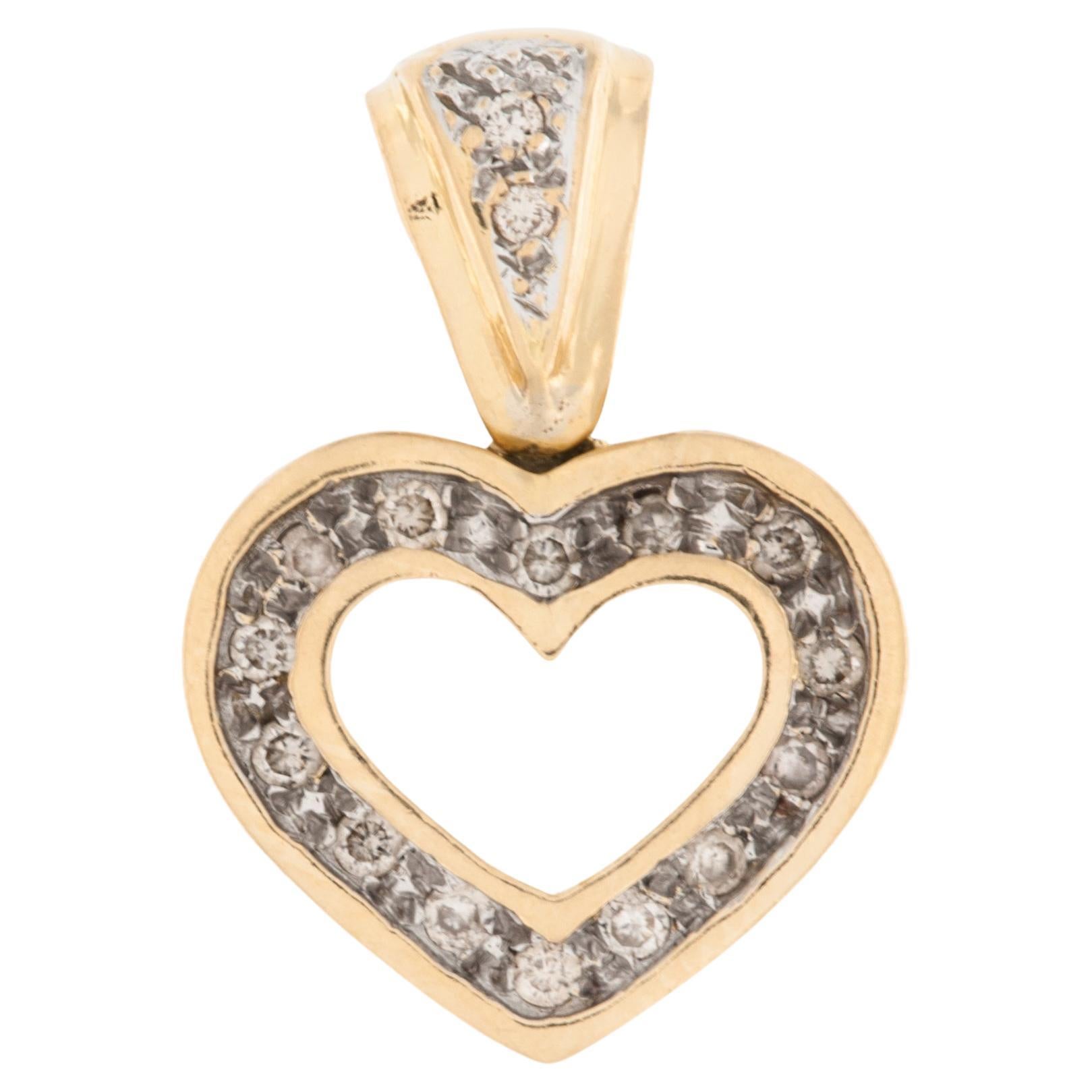 Pendentif cœur ouvert en or jaune et blanc 18 carats  en vente