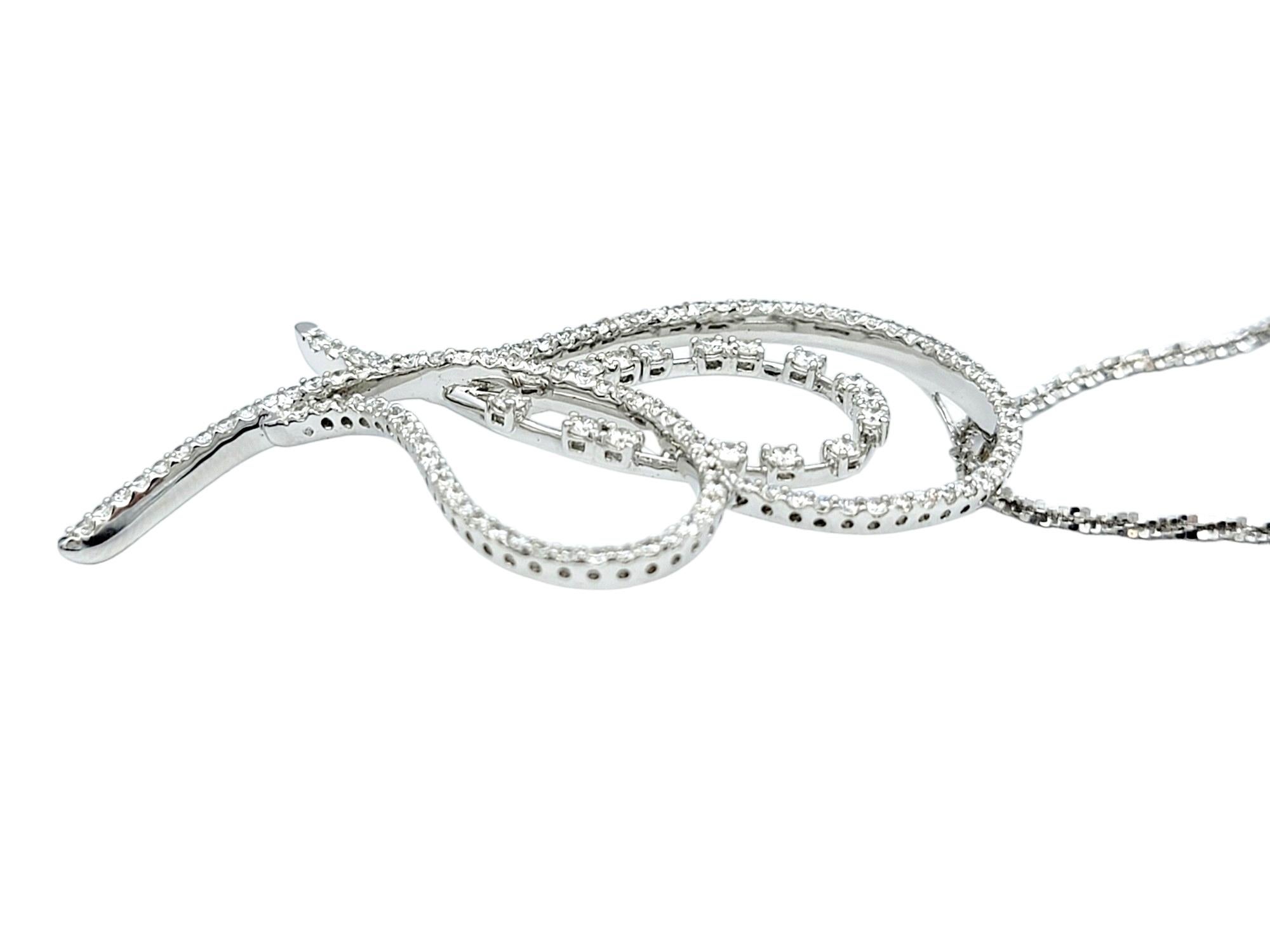 This gorgeous large diamond open heart pendant necklace is a modern work of art. This exquisite piece features an open heart design, generously adorned with sparkling diamonds that capture and reflect light with every movement.

The polished white