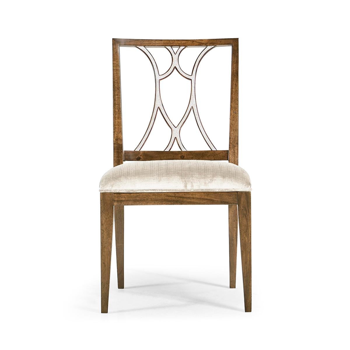 Crafted from rich mahogany, this chair features a classic silhouette that gracefully blends with any decor style. The chair's standout feature is its exquisite white eggshell inlay on both the inside and outside back, showcasing exceptional