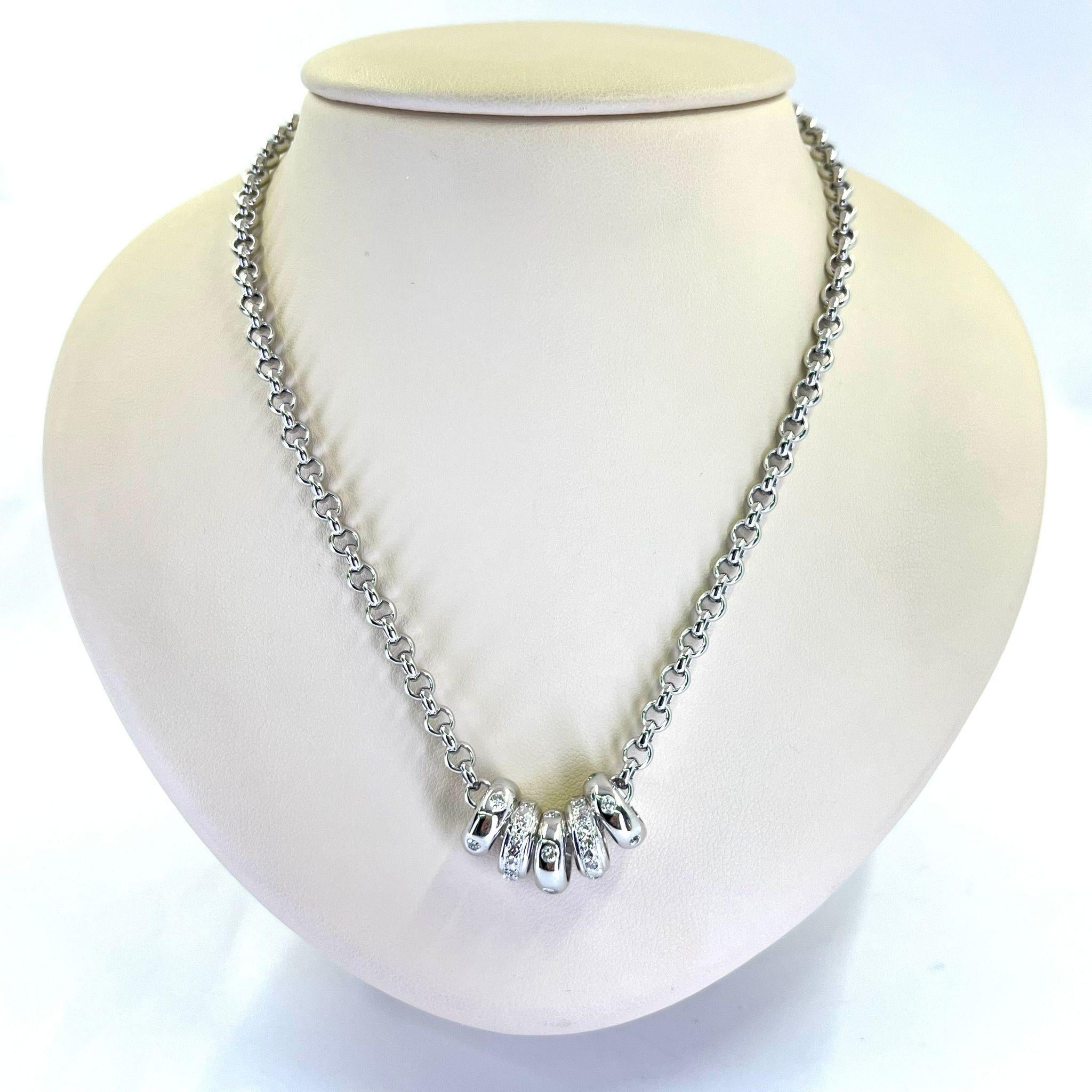 14 Karat White Gold Necklace Featuring 5 Sliding Rondelles Containing 36 Round Diamonds of SI Clarity and H Color Totaling Approximately 0.50 Carats. 16 Inch Rolo Chain with Lobster Clasp. Finished Weight is 20.3 Grams.