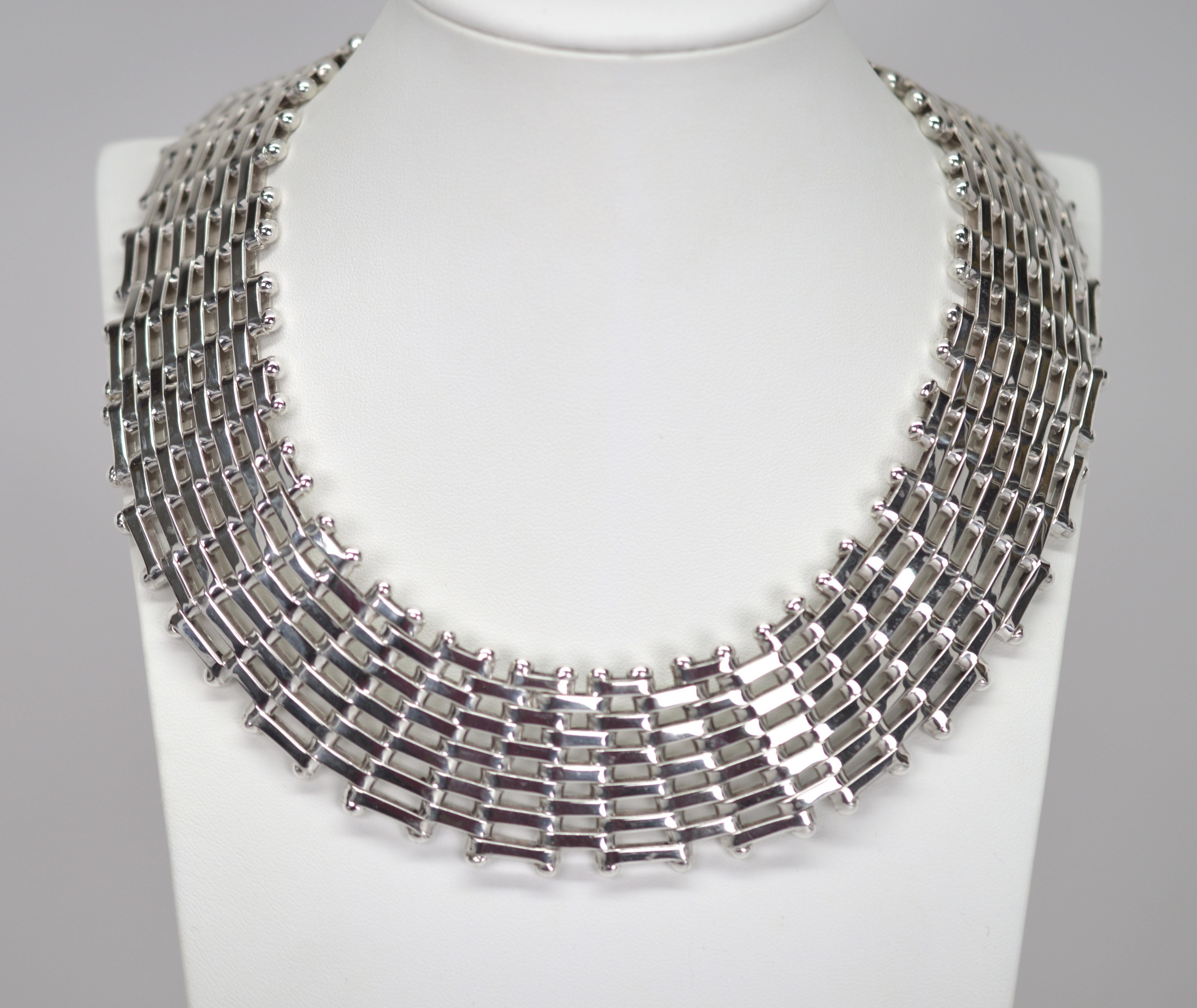 Let this bold sterling silver collar necklace lead when accessorizing your look. This fantastic retro find can uplift wardrobe basics to greatness when pairing with an outfit such as with a crisp white open collar blouse, jeans and a blazer or a