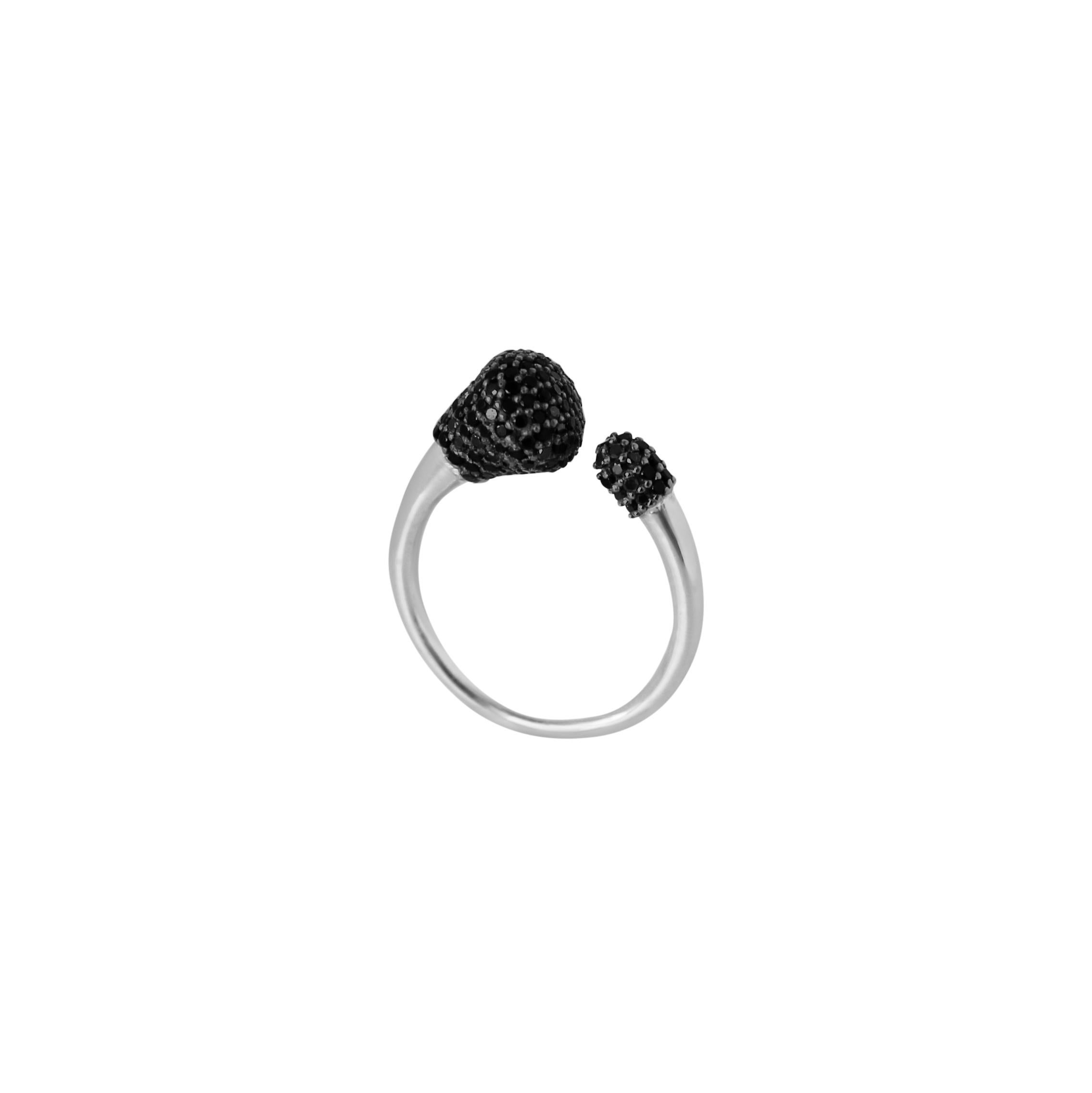 The open ring design is playful yet elegant, defined by the boldness of sterling silver and by the sophistication of sparkling handset black diamonds. Perfect worn solo or stacked with multiple rings from the same collection. 
Metal: sterling