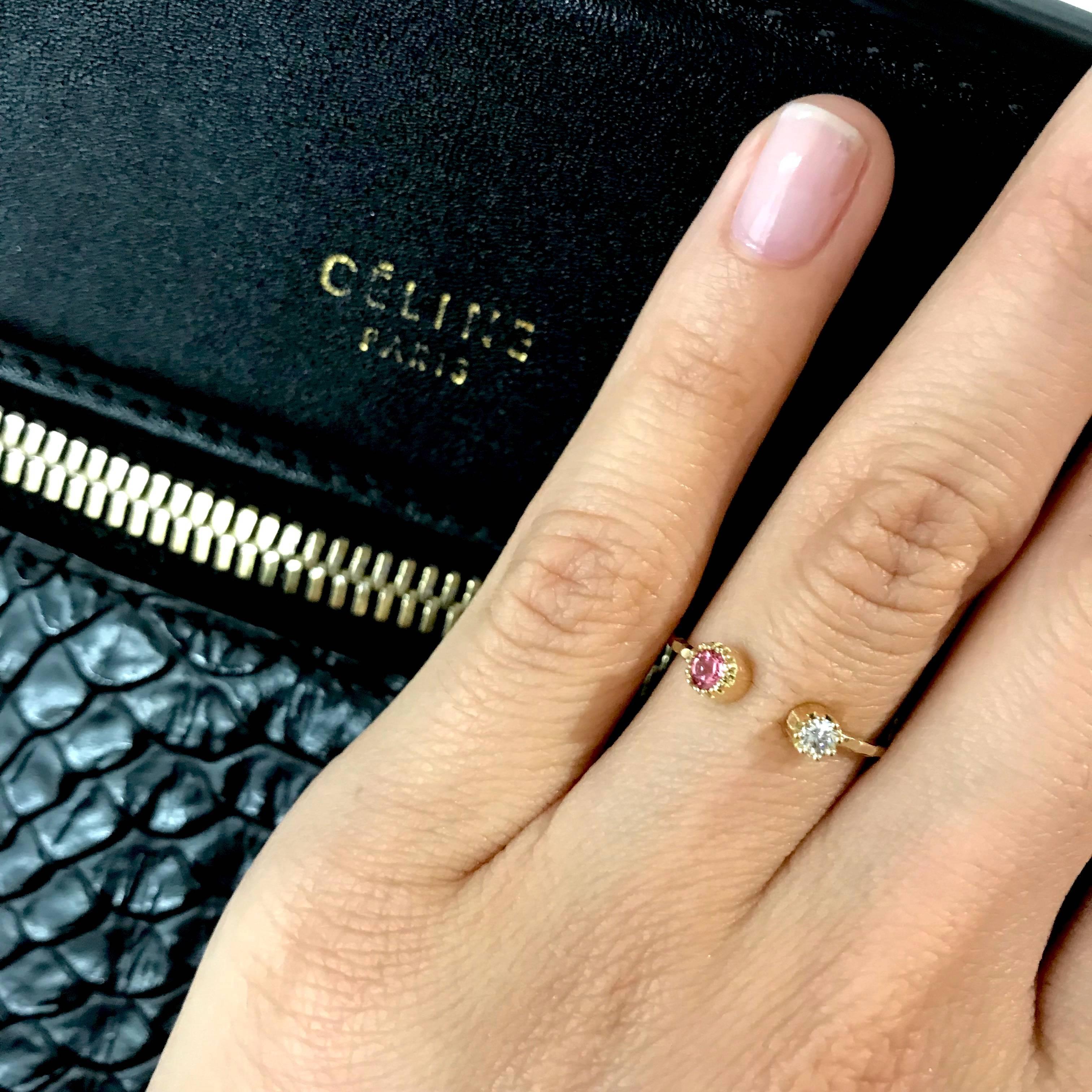 This delicate open ring features a diamond on one end, and a larger stone of the other, a pink tourmaline. However, the larger stone can be the stone and color of your choice, just make sure to tell us in the comments at checkout.   

The opening