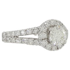 Anello solitario con diamante taglio brillante rotondo con gambo aperto