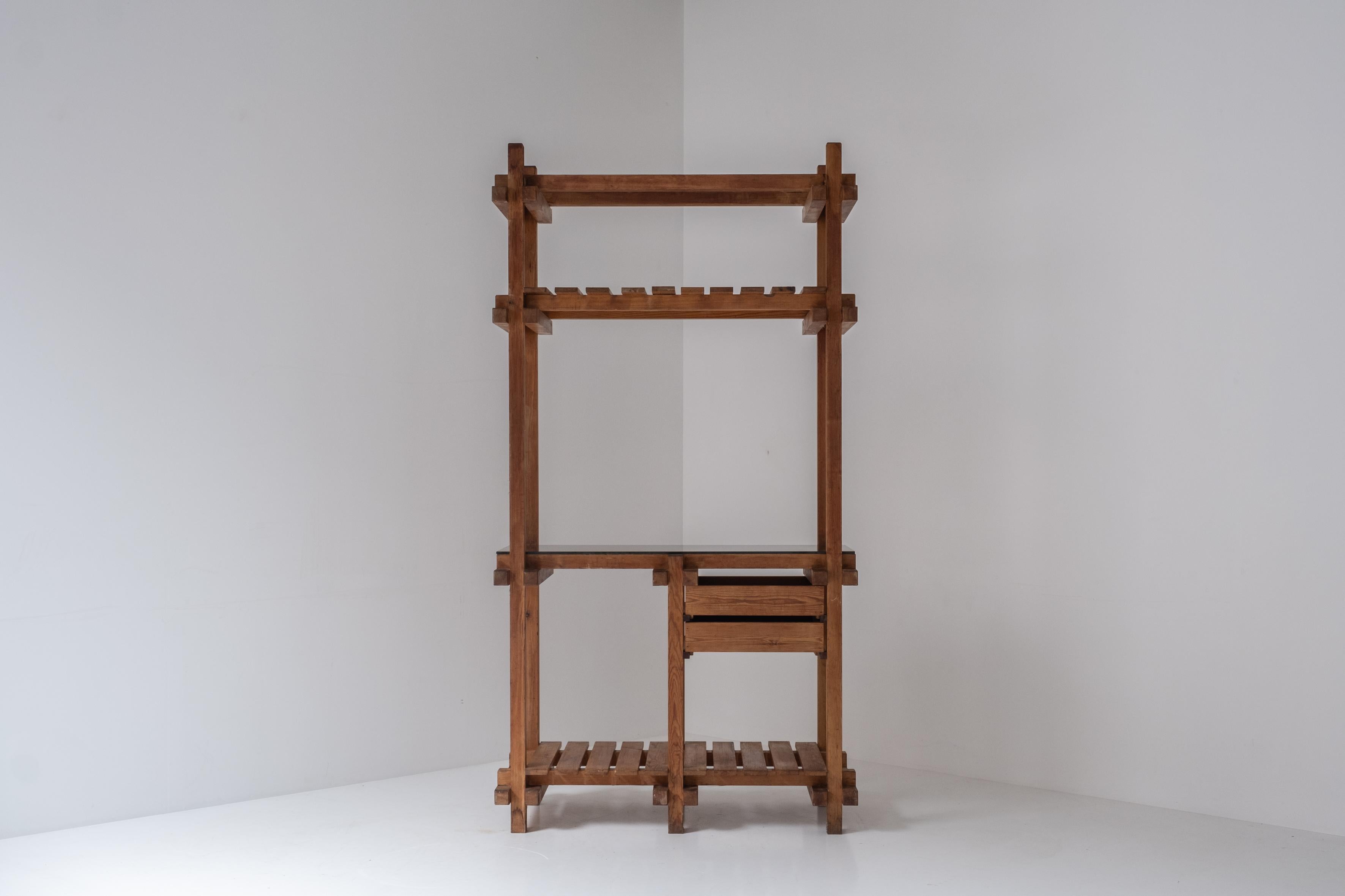 Open storage unit designed and manufactured in the 1970s. This prototype was made by a Belgian architect who was clearly influenced by the works by Pierre Chapo and even Gerrit Rietveld. The unit features a frame made out of pine. Visible signs from