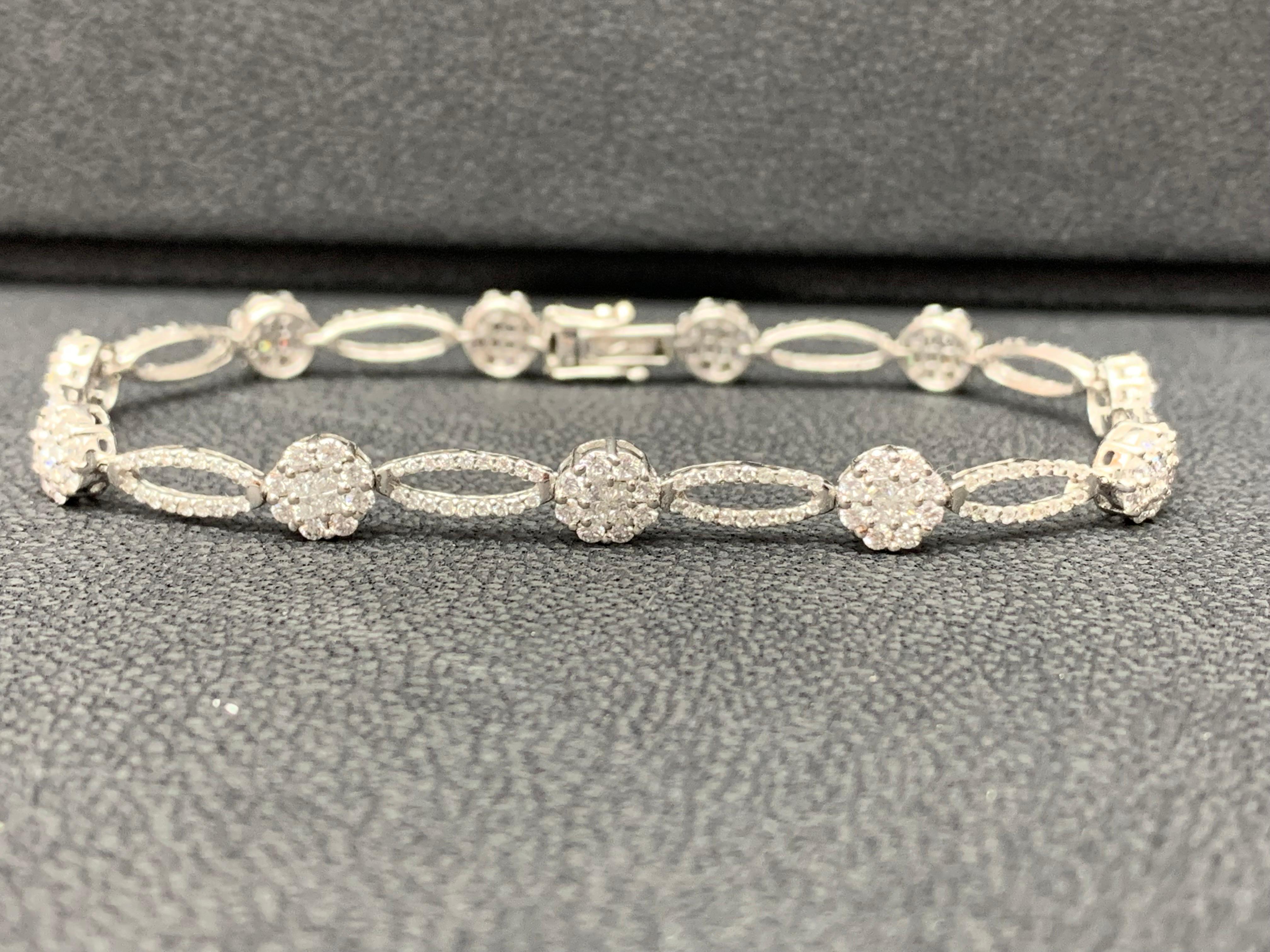 An antique Art Deco bracelet showcasing brilliant cut diamonds, set in an intricate open-work design made in 14k white gold. Diamonds weigh 2.39 carats total.
