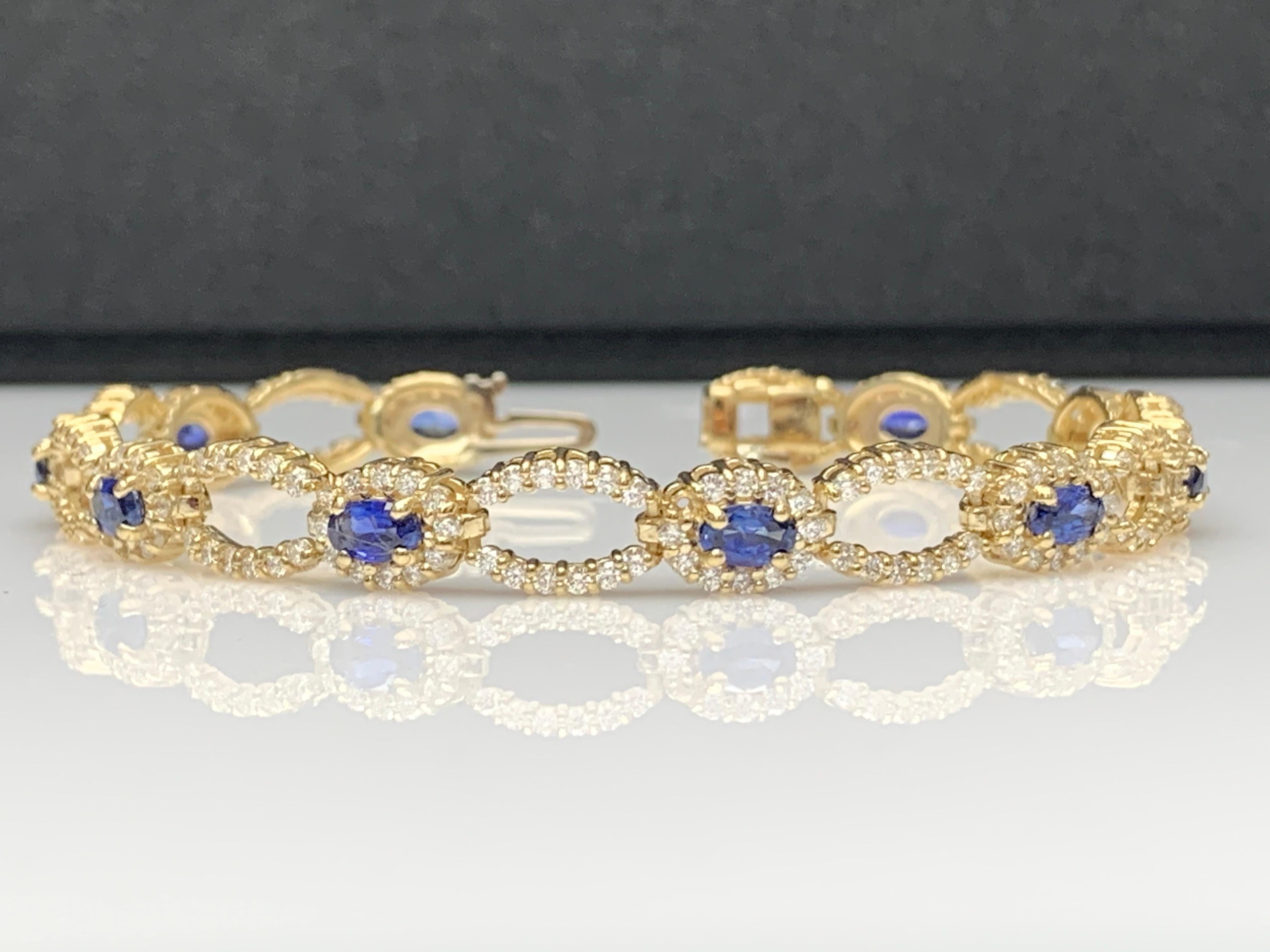 An antique Art Deco bracelet showcasing 10 oval cut blue sapphire weighing 3.60 carats. Surrounding the sapphire is a row of brilliant cut diamonds, set in an intricate open-work design made in 14k yellow gold. 240 Accent Diamonds weigh 3.06 carats