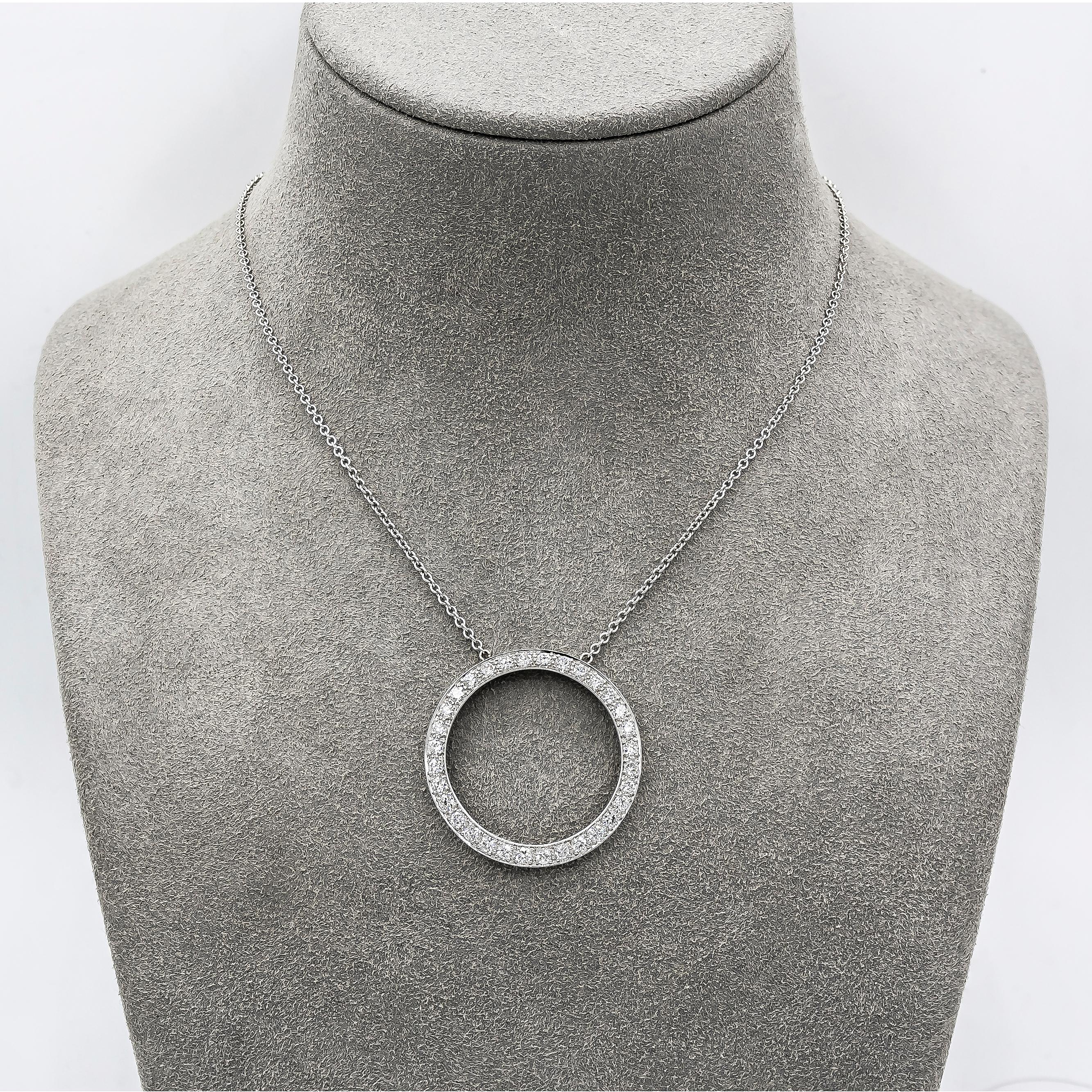 Features an open work circle pendant accented with round brilliant diamonds. Diamonds weigh 1.60 carats total. Made in platinum. 18 inch adjustable chain, 14k white gold.

Style available in different price ranges. Prices are based on your