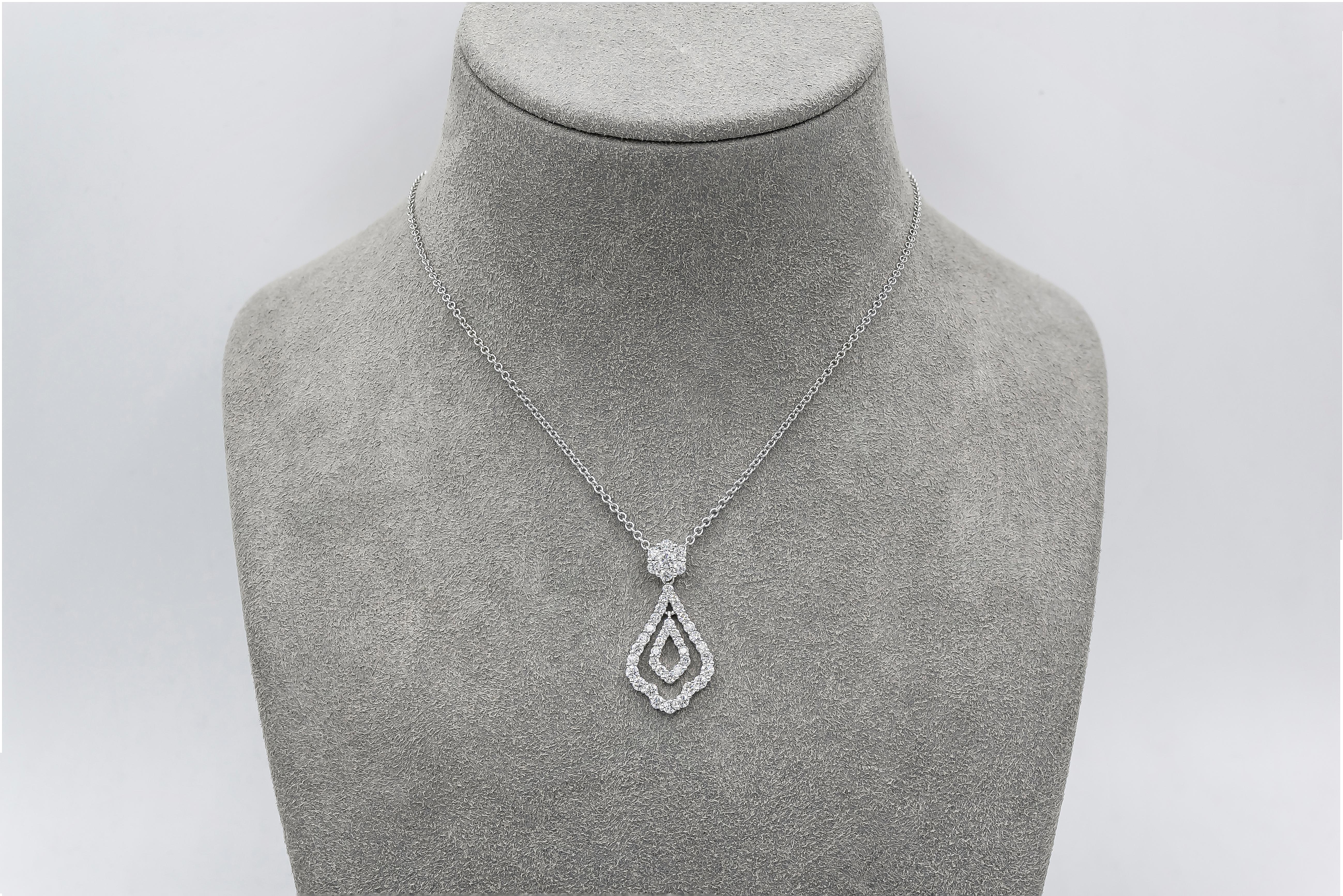 A drop pendant showcasing two rows of round brilliant diamonds in an open-work design. Attached to a round diamond halo and suspended on a white gold chain. Diamonds weigh 1.27 carats total.

Style available in different price ranges. Prices are