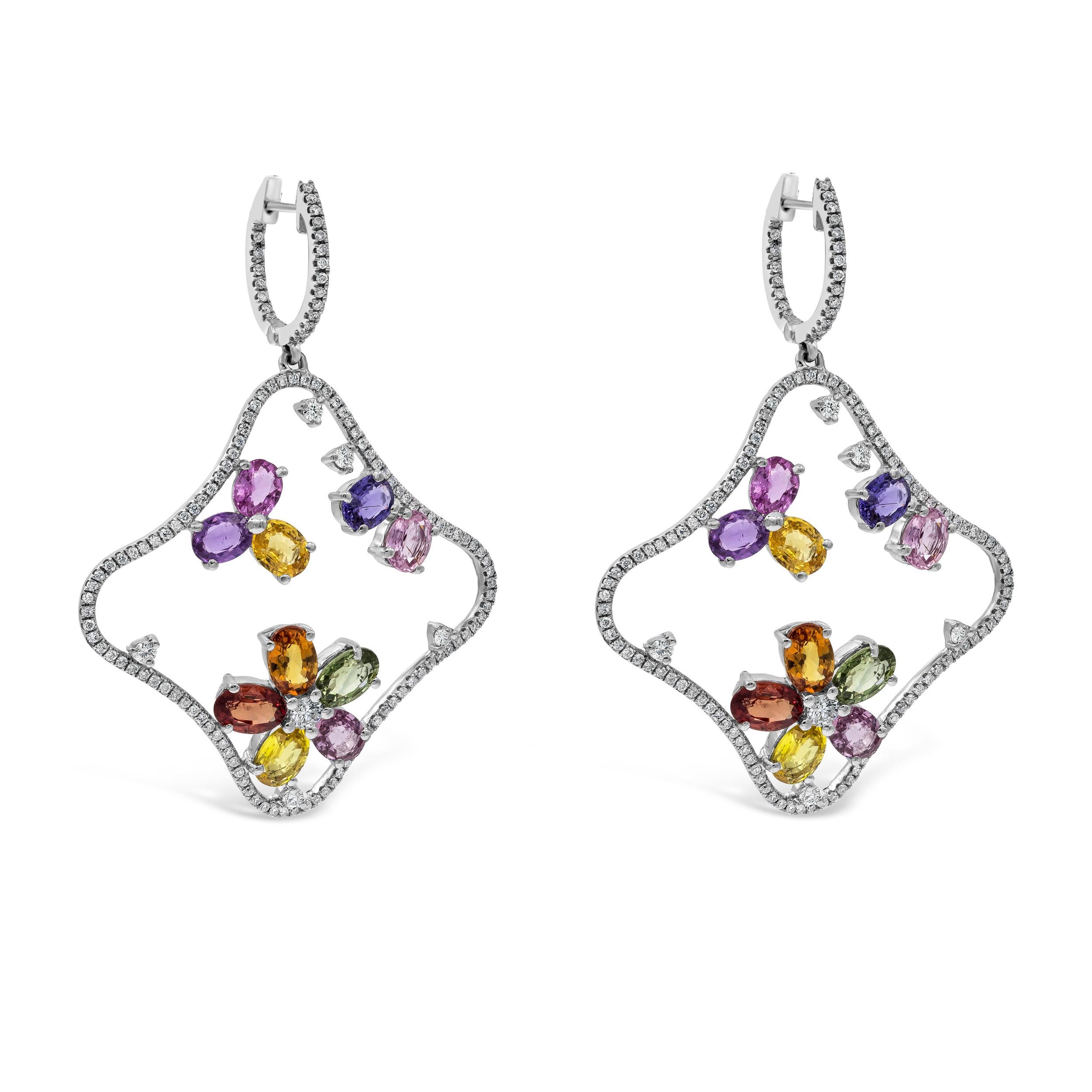 Features a fashion floral-motif dangle earrings showcasing 9.67 carats total oval cut multi-color sapphires. In an Open-work design, accented with melee round diamonds weighing 1.18 carats total. Made with 18K White Gold. 

Roman Malakov is a custom