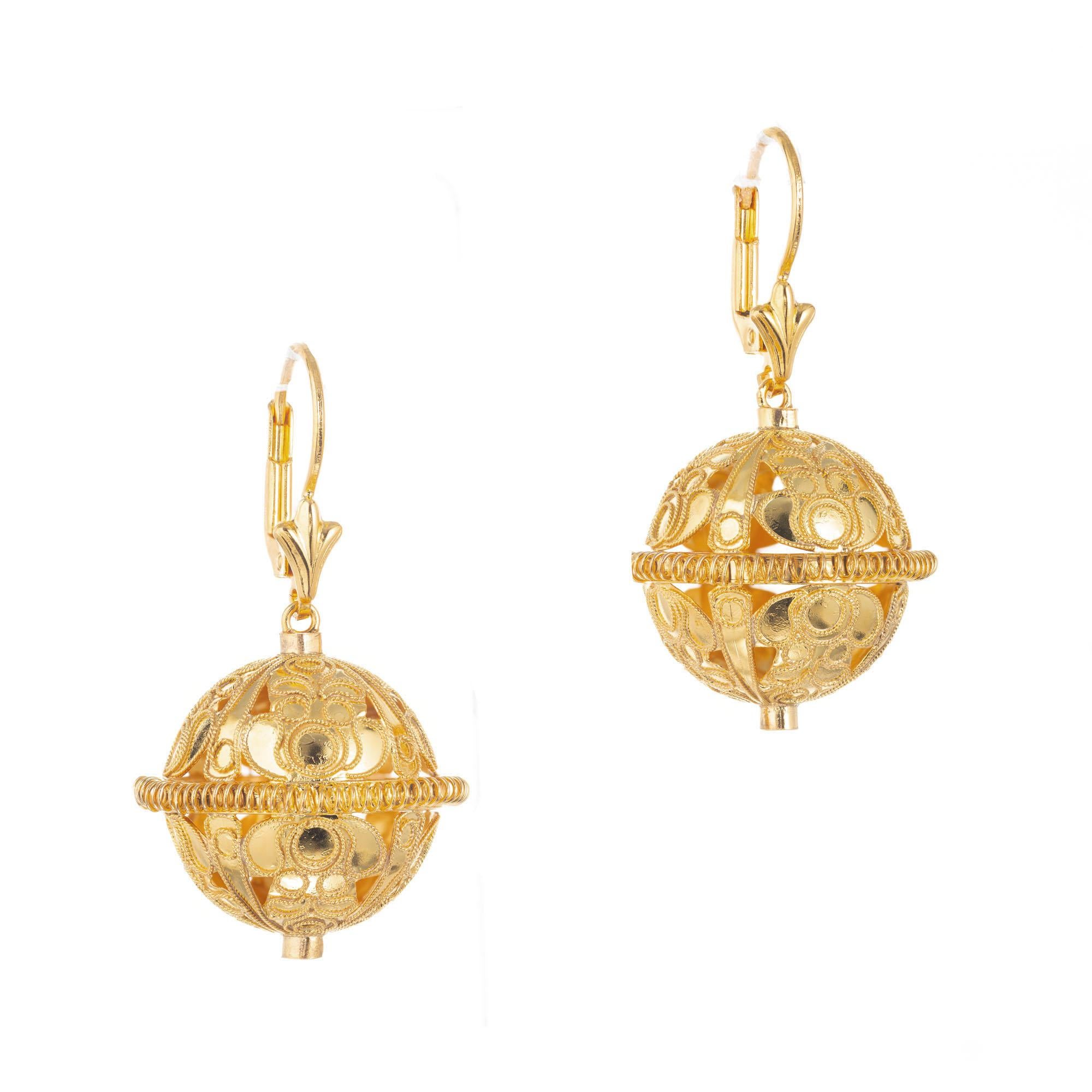14k yellow gold open work ball dangle earrings. 

Length: 1.11 inches or 28.37mm
Width: .84 inches or 21.48mm
Weight: 8.5 grams
