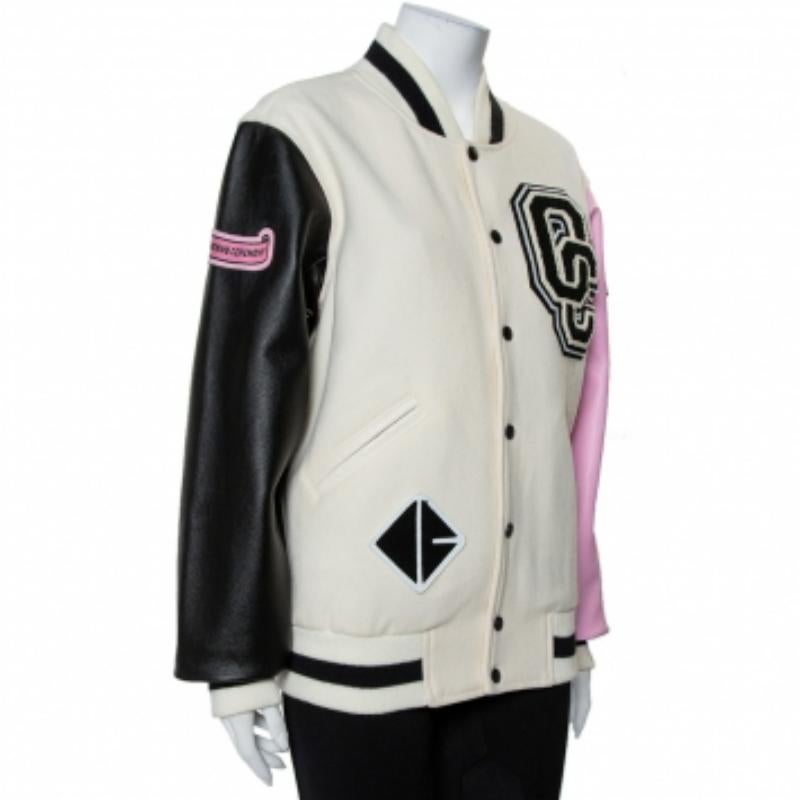 A Varsity jacket from Opening Ceremony made using wool and leather. It features logo appliqué details, front button closure, contrasting sleeves, and ribbed trims. Opening Ceremony is a brand founded in 2002 by Humberto Leon and Carol Lim.