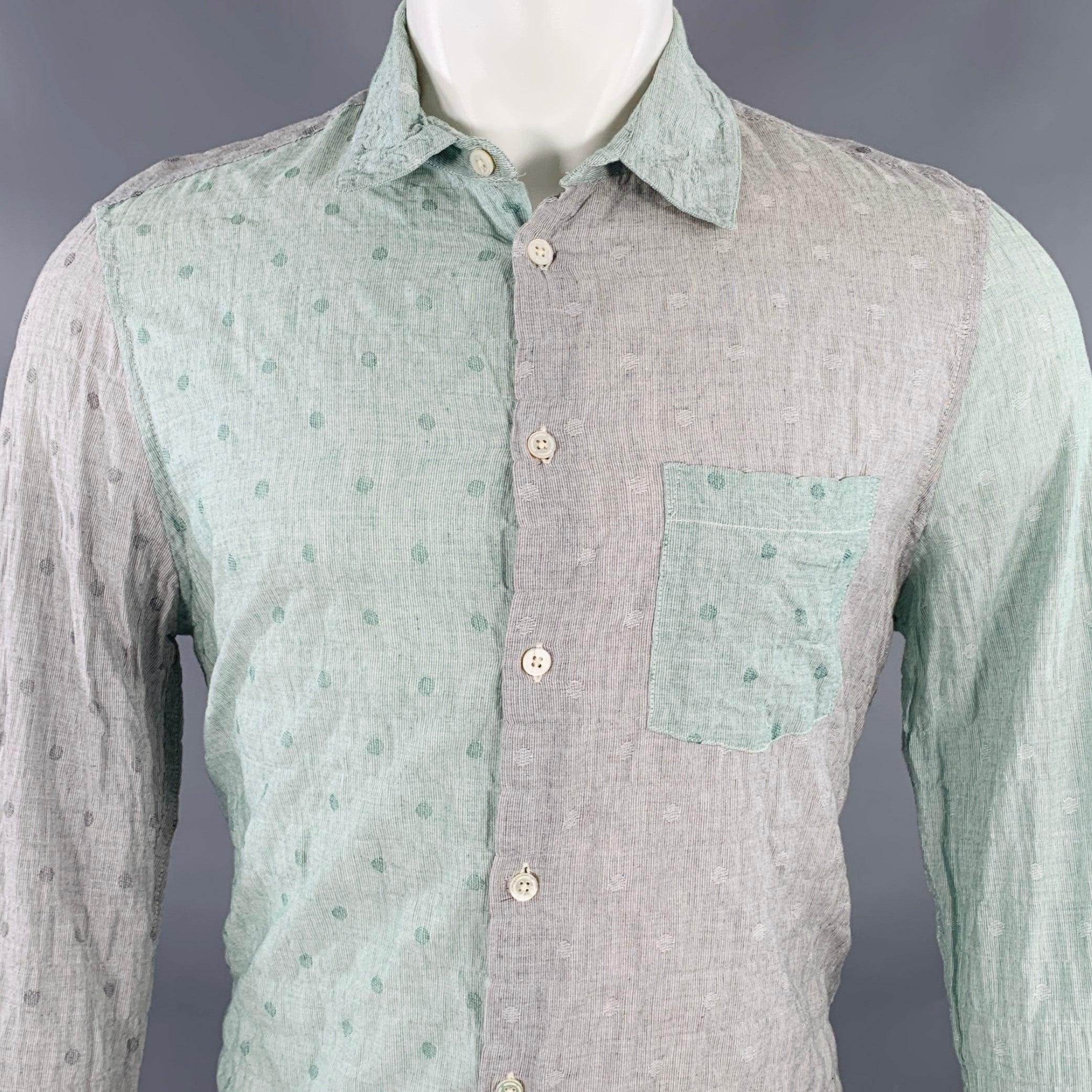 OPENING CEREMONY long sleeve shirt
in a grey and mint green cotton featuring a color block style, circles pattern, one pocket, and button closure. Made in USA.Excellent Pre-Owned Condition. 

Marked:   M 

Measurements: 
 
Shoulder: 16 inches Chest: