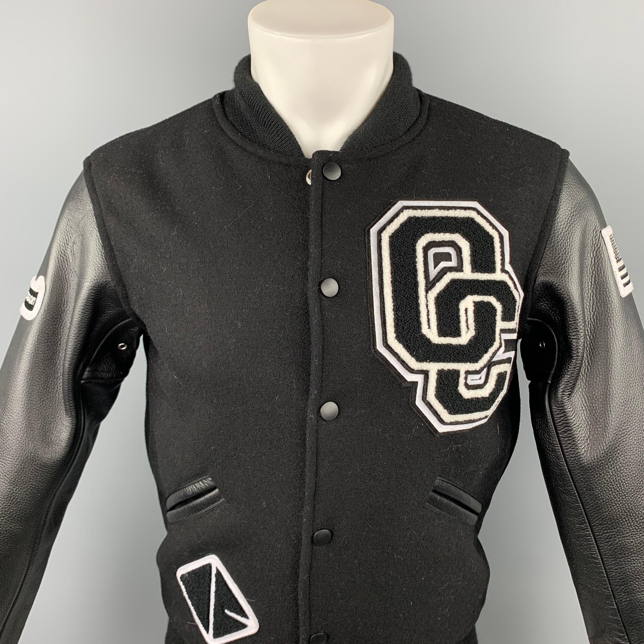 OPENING CEREMONY jacket comes in a black & white wool with leather sleeves featuring a varsity style, patch details, full liner, slit pockets, and a snap button closure.

Very Good Pre-Owned Condition.
Marked: XS

Measurements:

Shoulder: 18