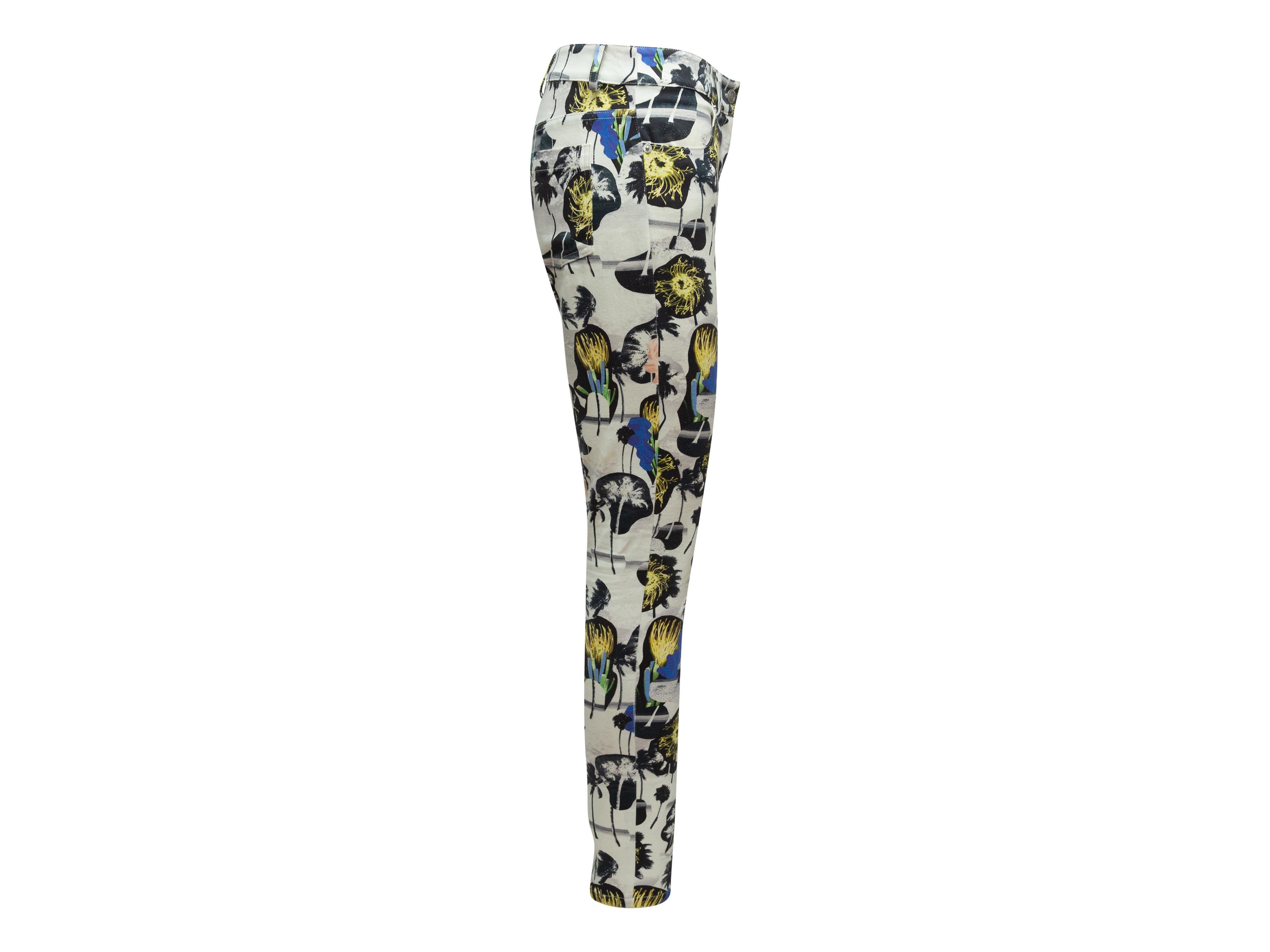 Product details: White and multicolor mid-rise skinny jeans by Opening Ceremony. Tropical palm tree print throughout. Four pockets. Zip-fly closure. 29