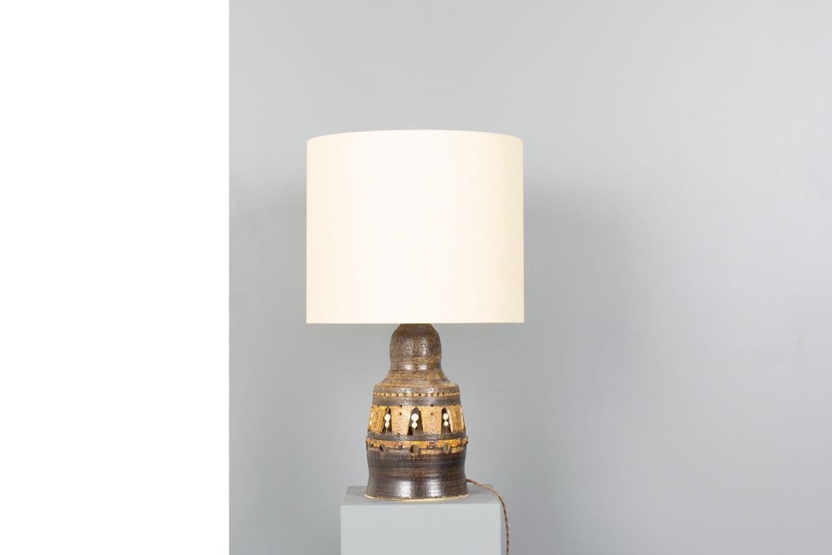 A striking sculptural table lamp by renowned French ceramicist Georges Pelletier, handcrafted in the 1970s. This piece exemplifies Pelletier’s singular artistic vision, where light and form engage in a poetic dialogue.

The glazed stoneware base