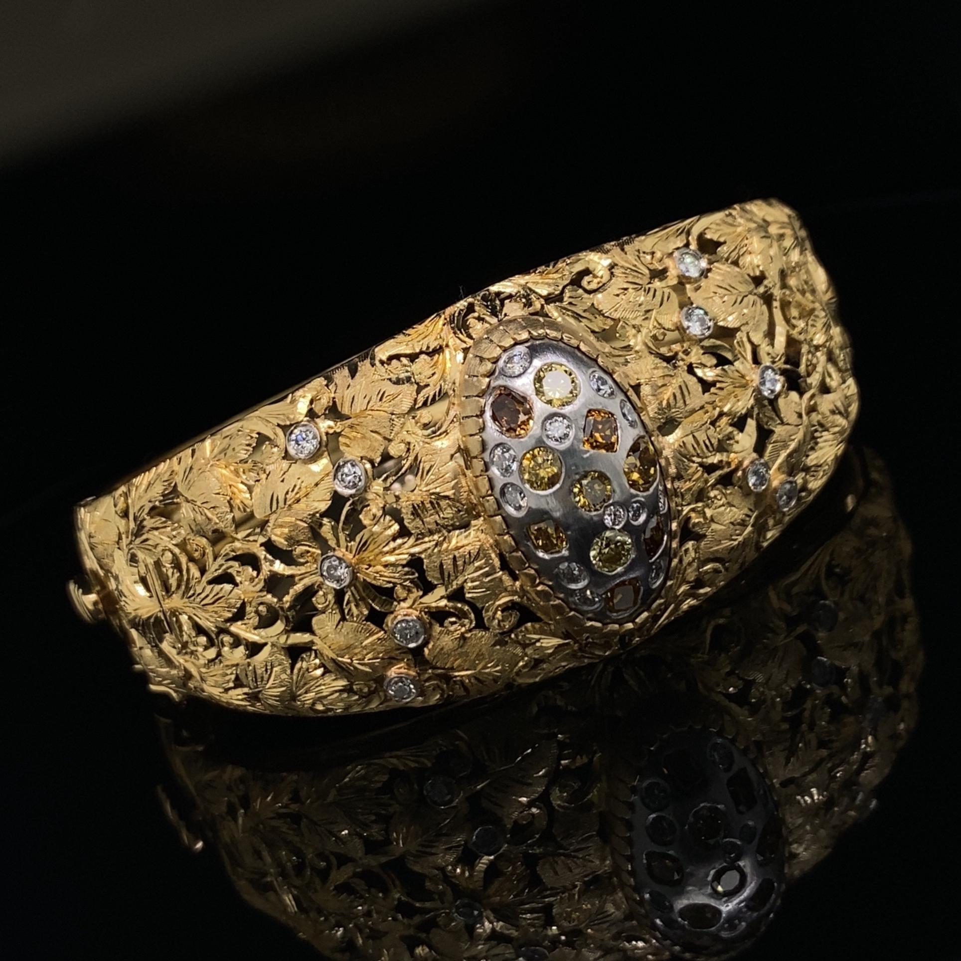 This beautifully made, 18 karat yellow gold cuff came to us with a dreary smoky quartz set in the center.  Eytan Brandes jettisoned the questionable quartz then fashioned a 14 karat white gold plate to fit the center, then set it with a beautiful