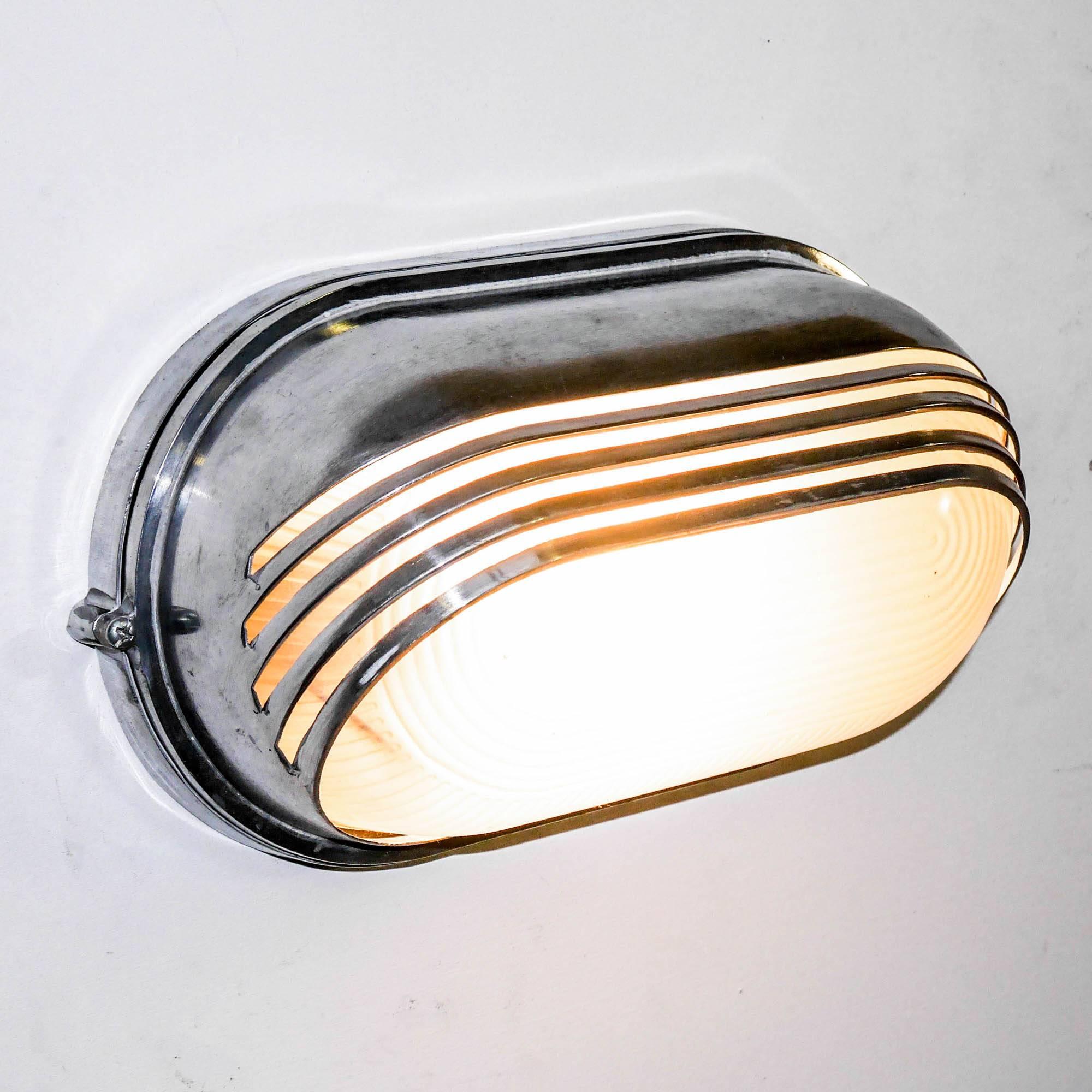 Industrial Openworked Wall Light Large, in Polished Aluminium and Reeded Glass, circa 1970
