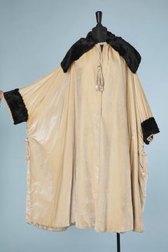 Opera coat in ivory silk velvet with black furs  Circa 1920's Stern Brother