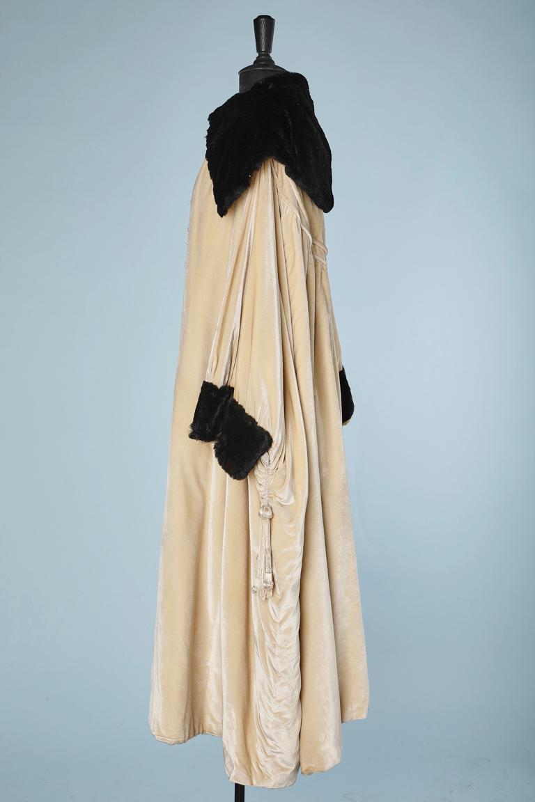Opera coat in ivory silk velvet with black furs  Circa 1920's Stern Brother  1