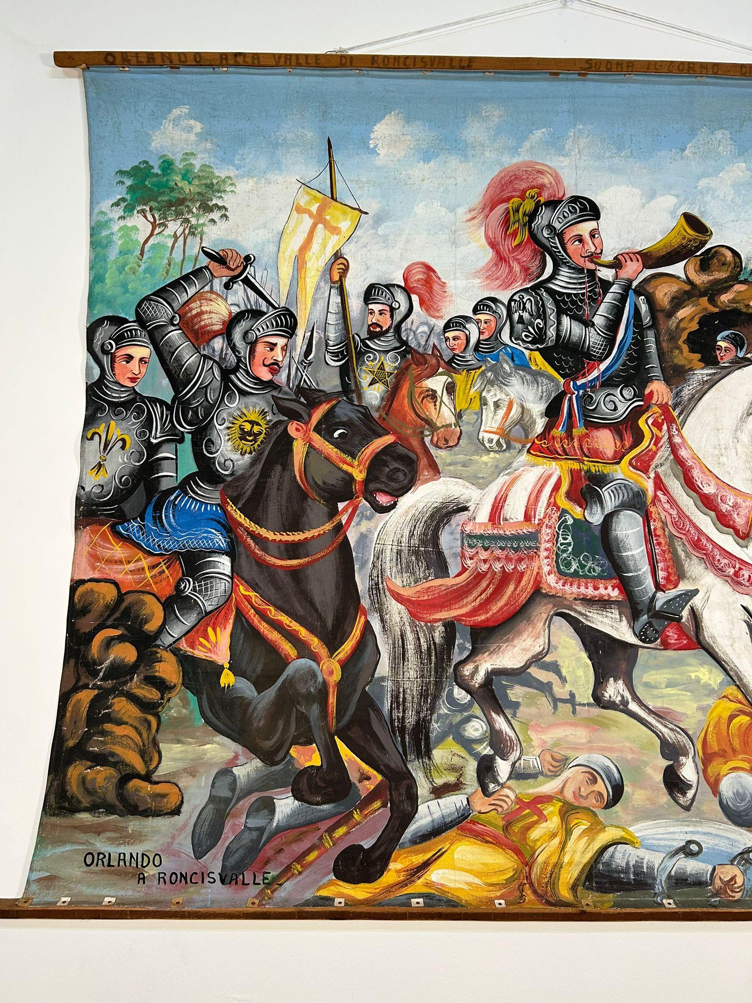Opera dei Pupi theater backdrop painted on canvas by F. Paolo Cardinale, 1940s

It depicts the paladins of France during the epic Battle of Roncesvalles.
At the top left, on the wooden board, you can see the name of Giacomo Cuticchio, a well-known