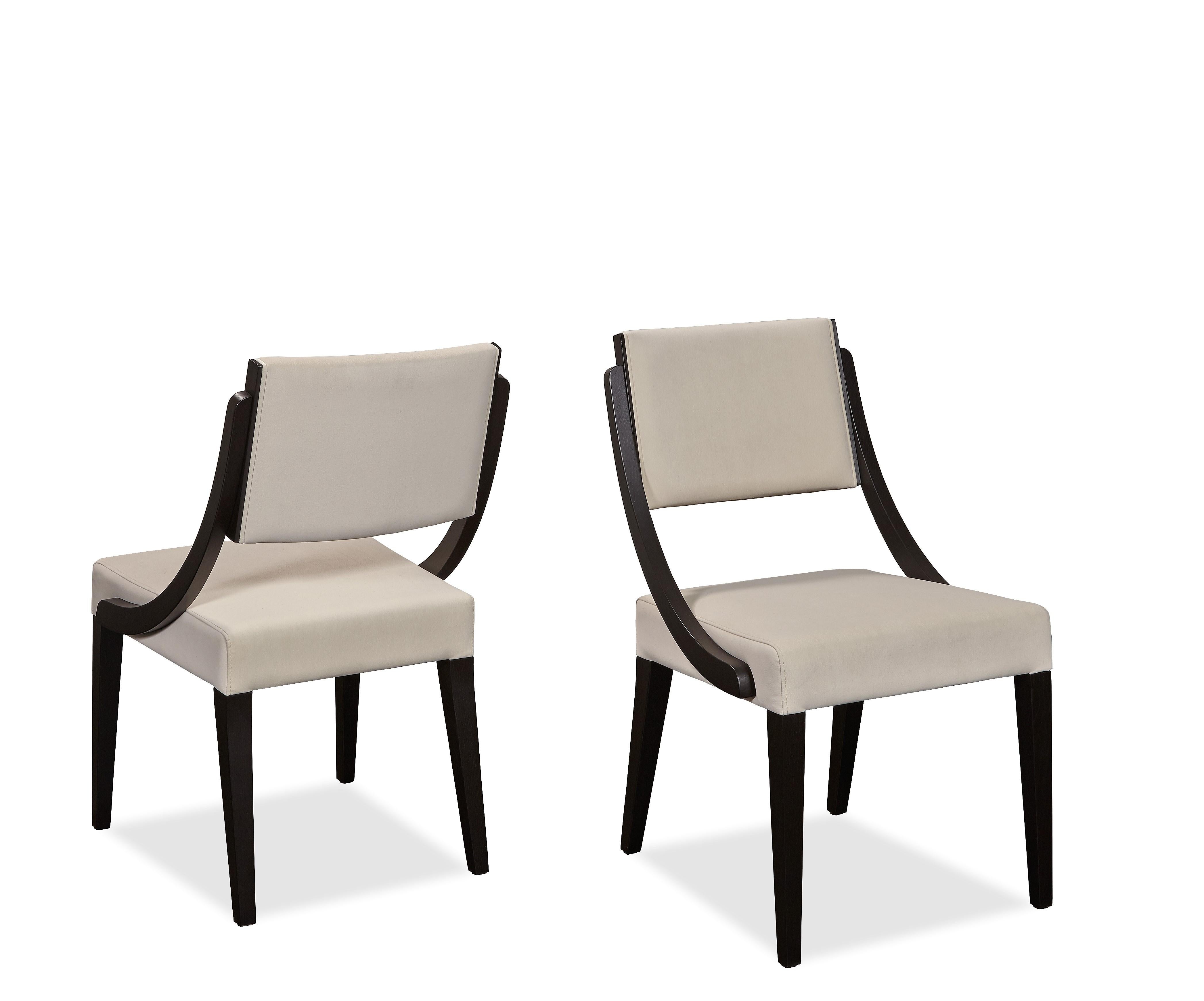 The minimalistic design of the chairs brings a sense of sophistication while maintaining comfort. Constructed in
black oak frame and upholstered in high quality cream leather.
100% European handmade product.
Available in COM and variety of wood and