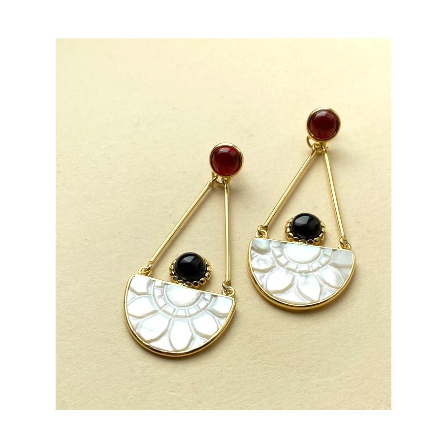 'Opera' earrings by Vintouch pay homage to the grace of ballet dancers, with their hand-carved from mother-of-pearl semi-circles suggesting the form of the tutu. These 24-karat gold vermeil earrings are masterfully handmade in Italy, enriched with