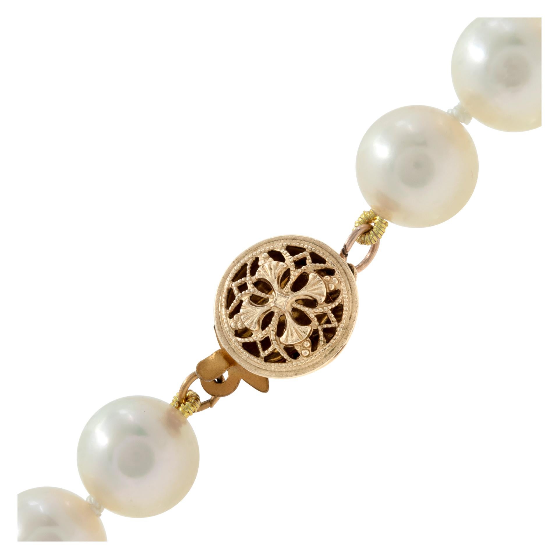 Opera length, strand of Akoya pearl necklace with 14kt yellow gold clasp. One hundred thirty three Akoya pearls are 7.5 x 8 mm. Length: 44  inches.

