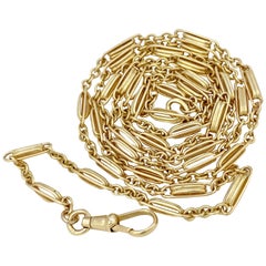 Opera Length Yellow Gold Trombone Fetter & Link Chain with Dog Clip, circa 1920