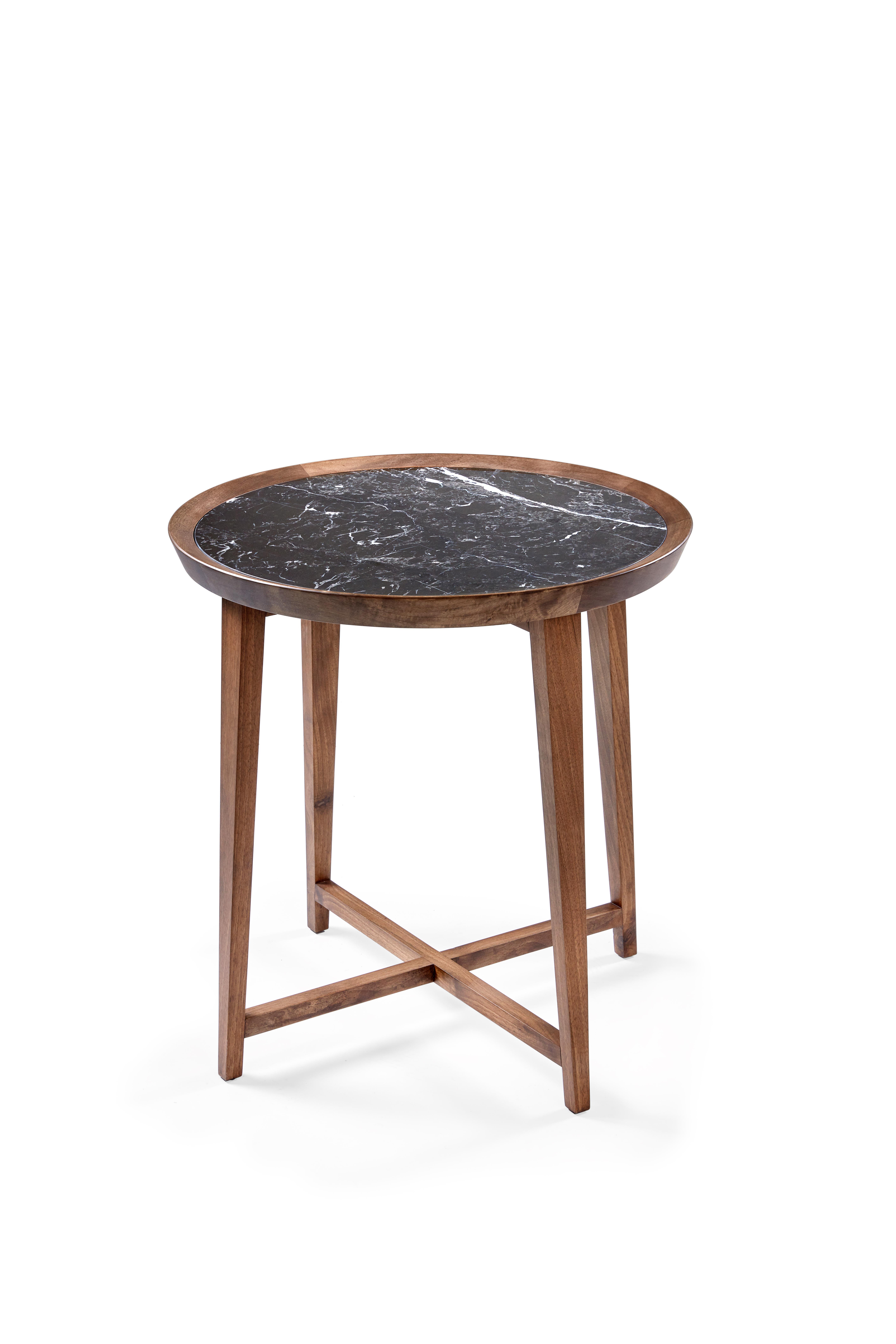 A set of three varying diameters and heights, the Opera table exemplifies simplicity in form and a focus on material. The marble inset tray top on X-frame wood base allow this piece to work with almost any style room.