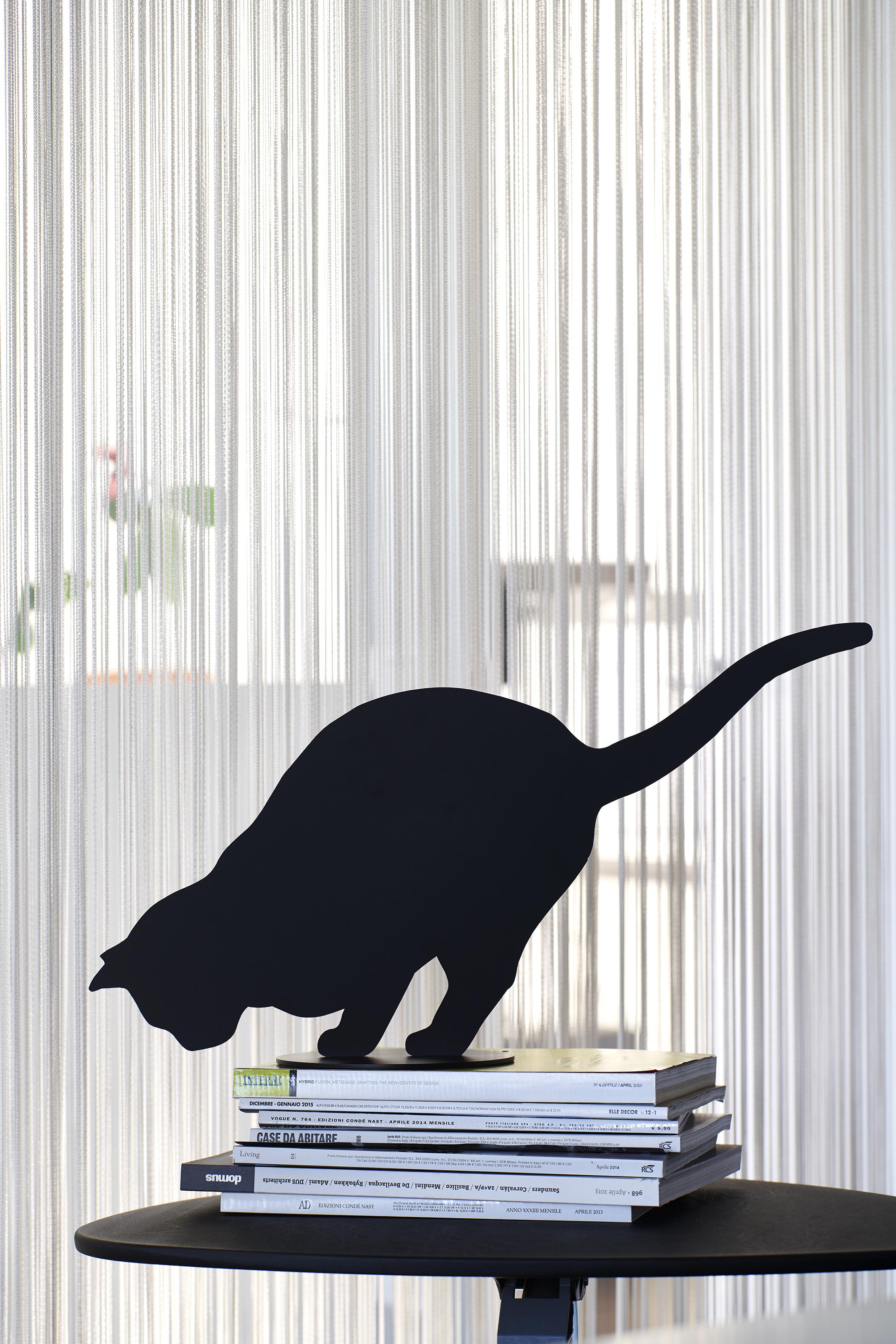 Ombres de Chats by Angelo Barcella are poetic objects, delicate table sculptures. Shadows of curious, busy, sore, angry or bored cats, instants which are made eternal when transformed into some very special steel furnishing accessory. The Ombres de