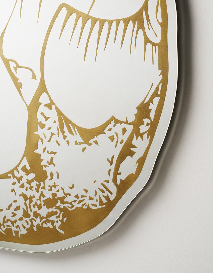 Selce is a shaped mirror designed by Marcantonio, with golden serigraphy decorations that re-interpret the first crafted stones. It is a tribute to the know-how of mankind: our ability to learn, absorbing the techniques used by our peers, and the