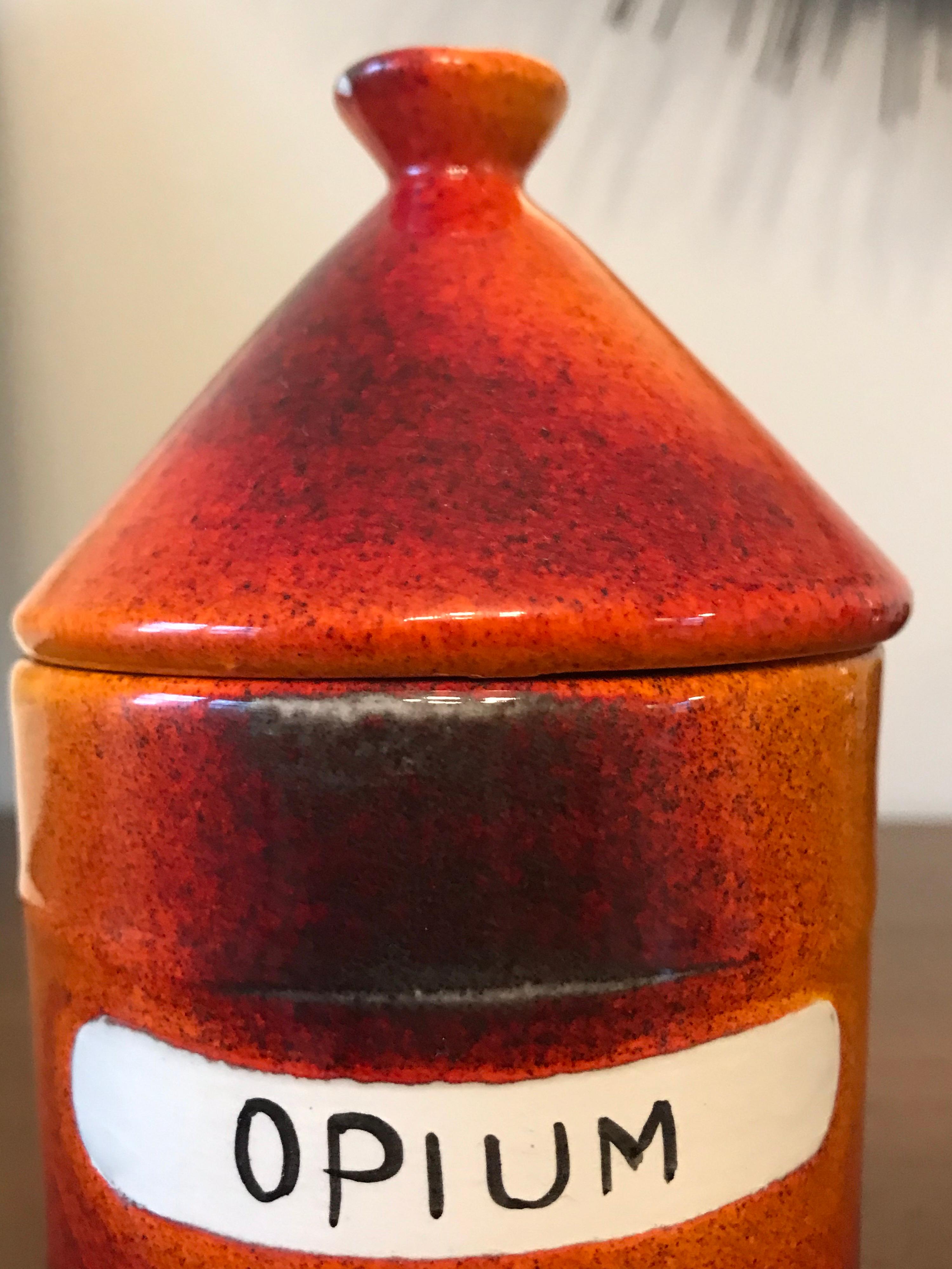 Ceramic lidded jar by Alvino Bagni for Raymor. Beautiful orange color. Two small imperfections to lid as seen in pictures, both being on the underside.