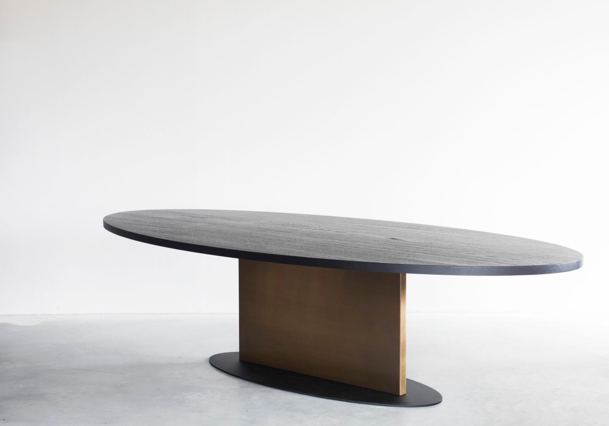 Opium oval table with brass detail by Van Rossum
Dimensions: D240 x W120 x H75 cm
Materials: Oak, brass, steel.

The wood is available in all standard Van Rossum colors, or in a matching finish to customer’s own sample.
Detailing is available