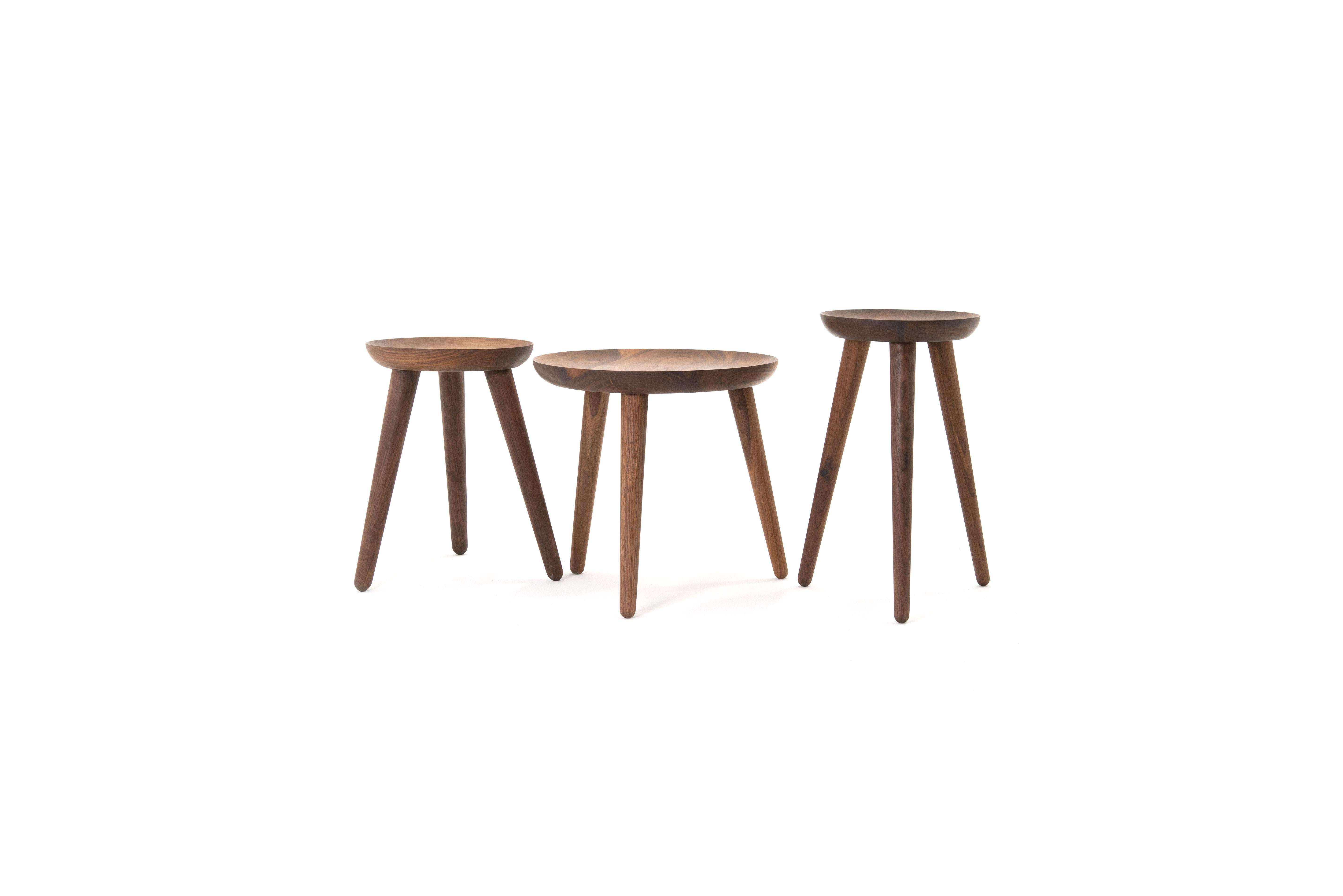 The opium is a set of side tables, also available individually, made from turned solid walnut and angled tenon joints. The wood top is inspired by the shape of the opium poppy and fits instantly in modern and classical homes. 

This handcrafted