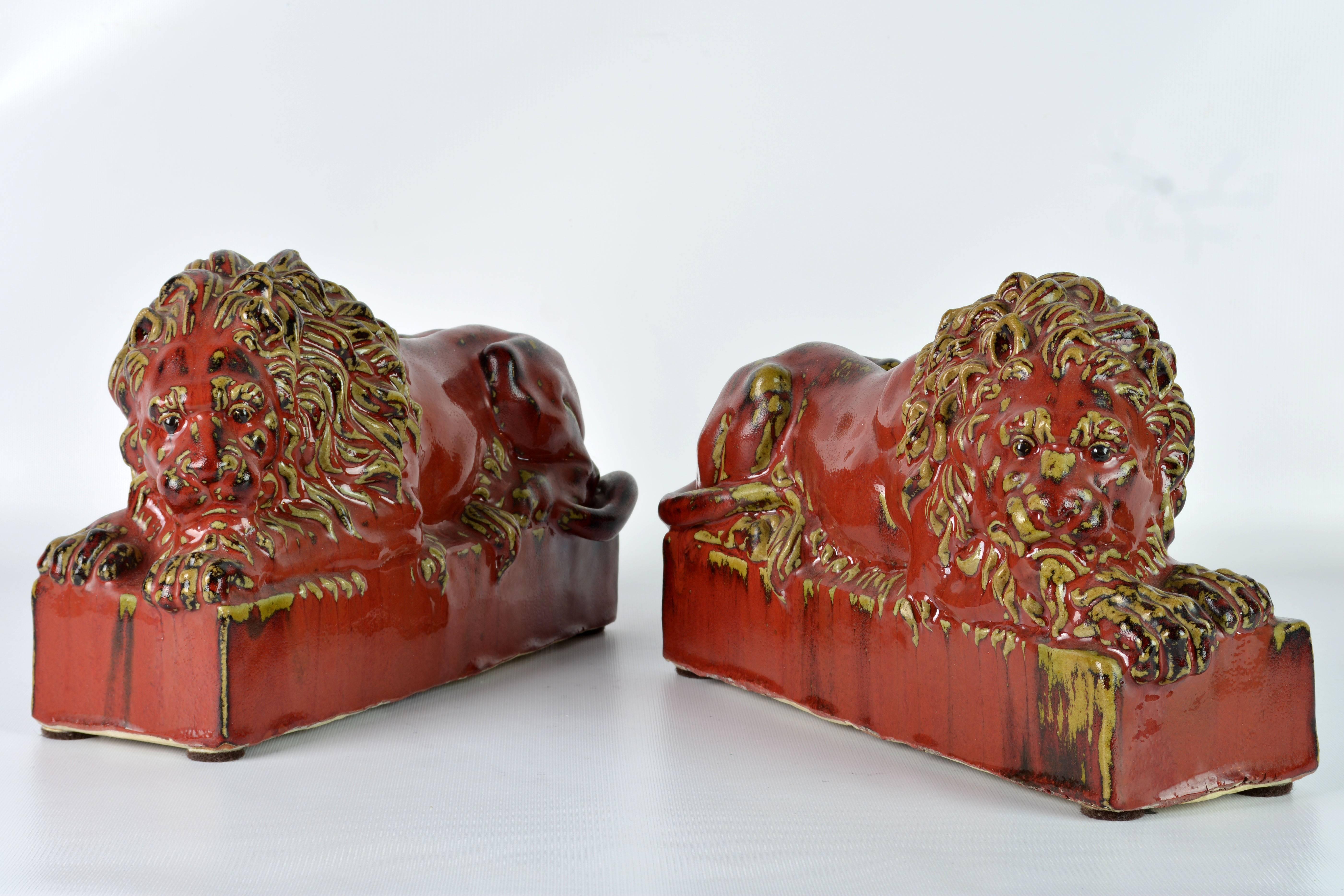 Modern Opposing Pair of 20th Century Oxblood and Celadon Glazed Ceramic Resting Lions