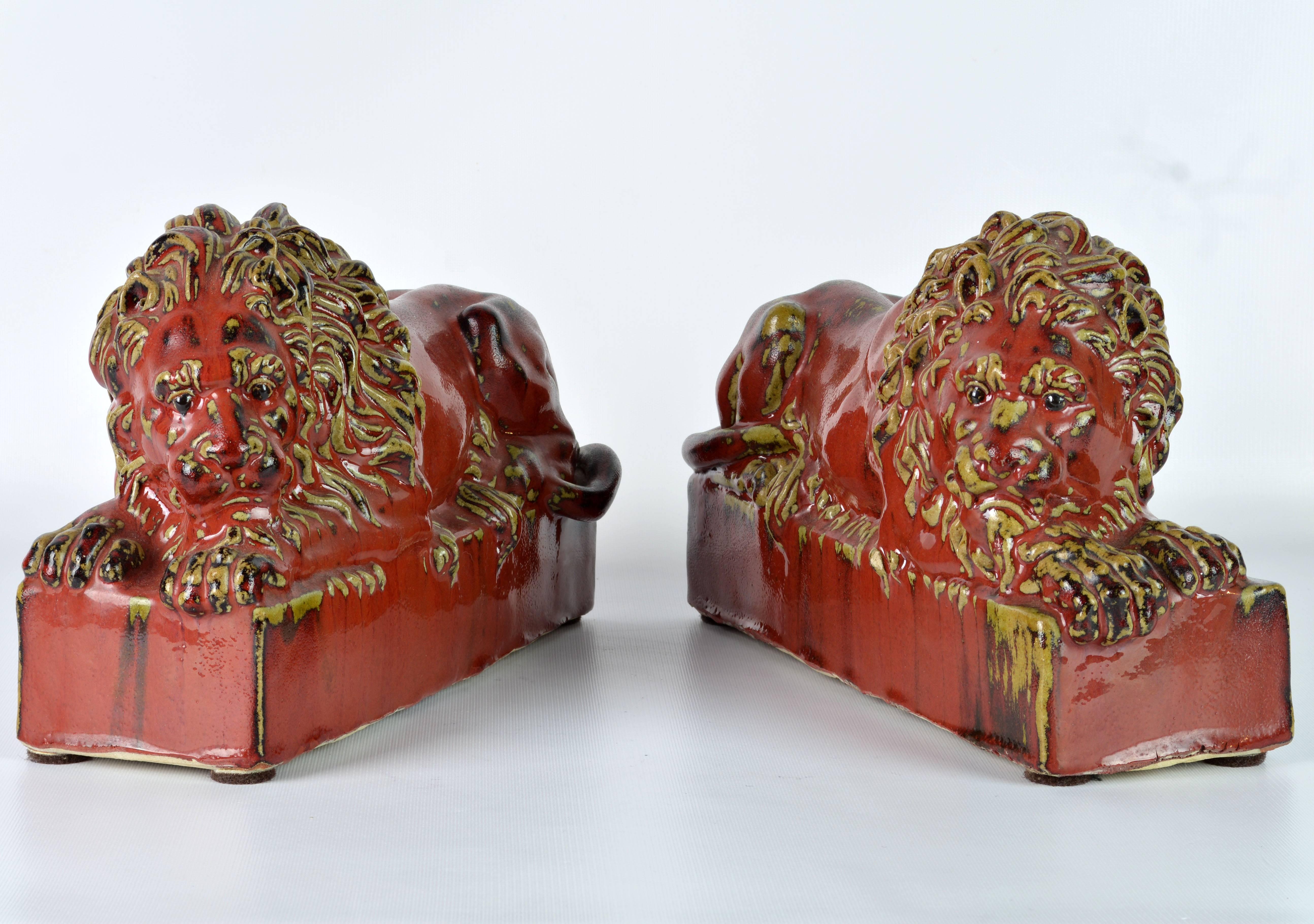 Opposing Pair of 20th Century Oxblood and Celadon Glazed Ceramic Resting Lions 1