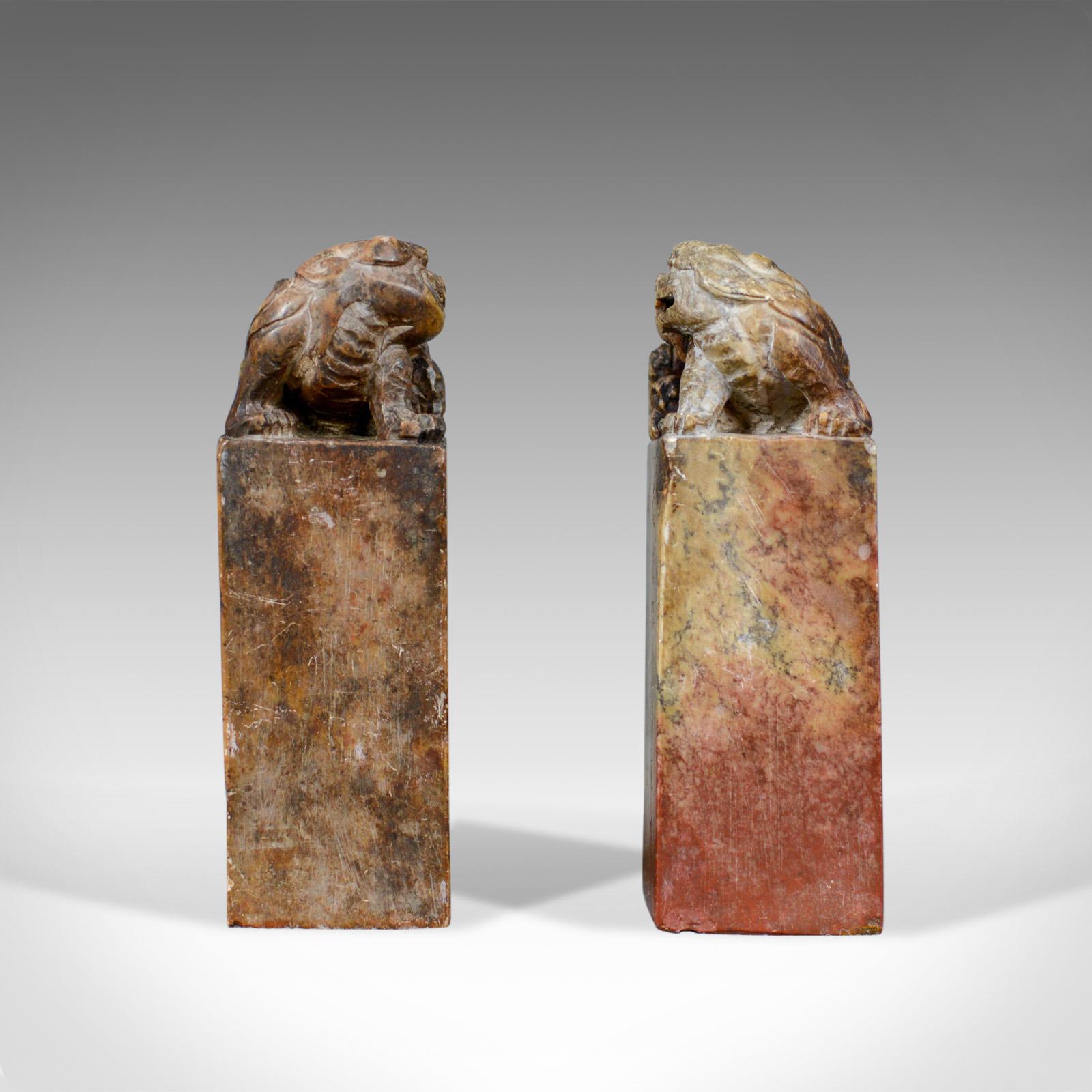 This is an opposing pair of Chinese soapstone seals surmounted with hand carved 'dogs of Foo' dating to the 20th century.

Tactile and attractive Chinese soapstone seals
Block form surmounted by hand carved 'dogs of Foo'
Hand carved seal